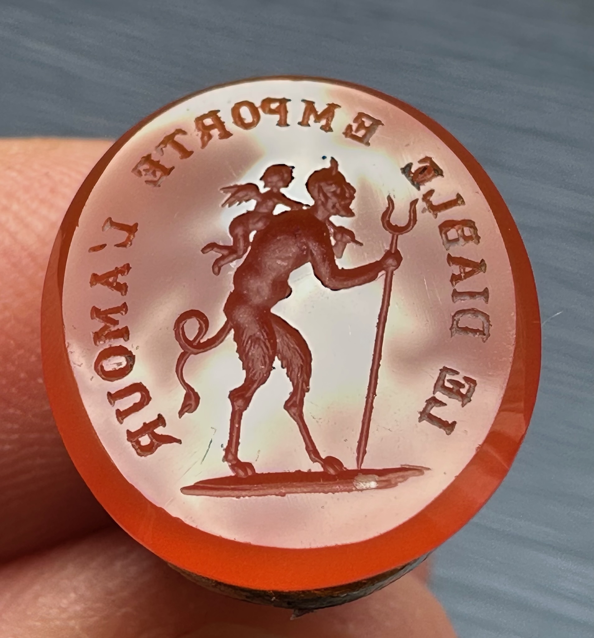 A 19th c. Puss in Boots gilt-metal fob seal with carnelian intaglio "Le diable emporte l'Amour".