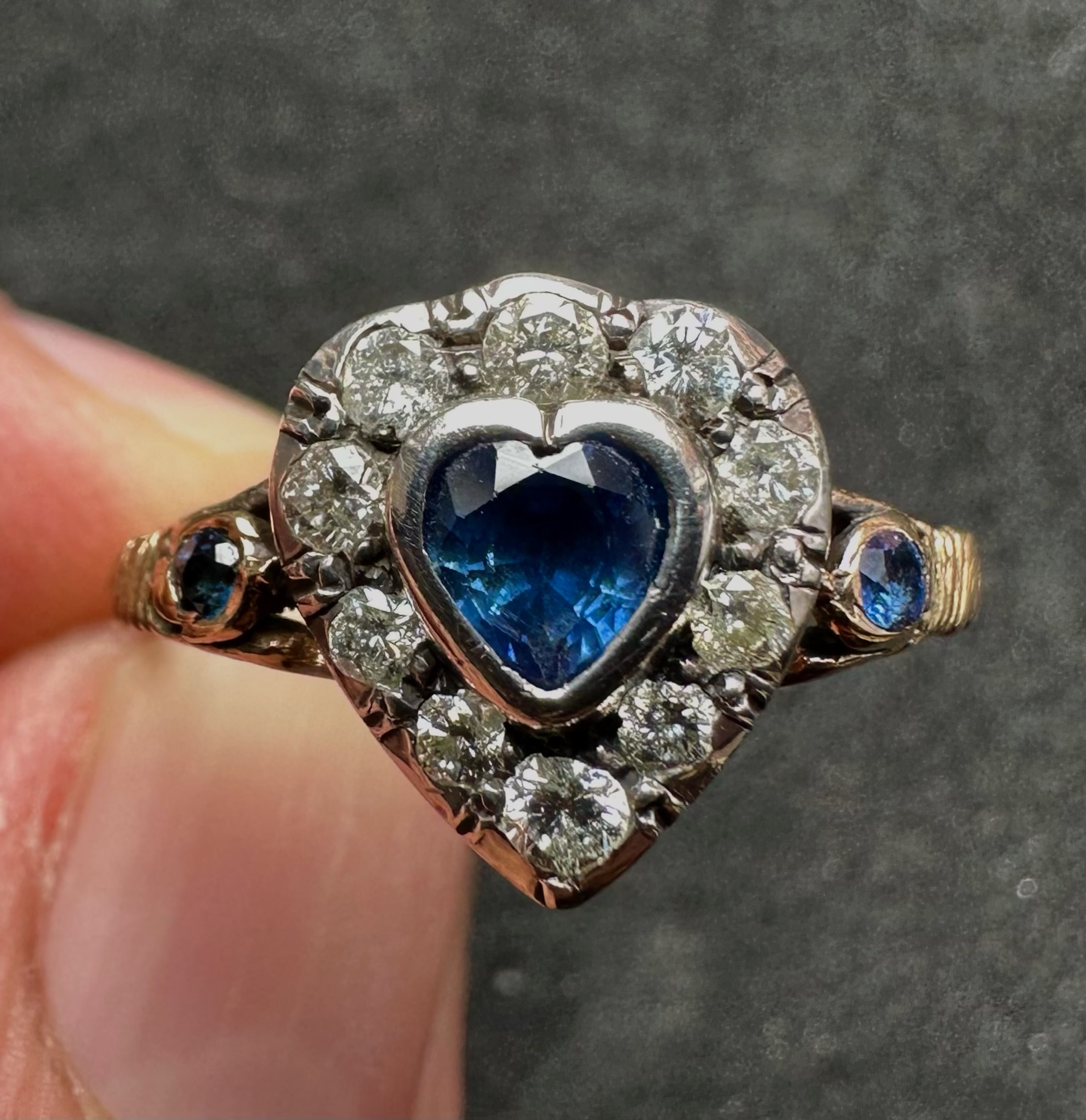 A 19th-century heart-shaped sapphire and diamond ring, gold and silver.