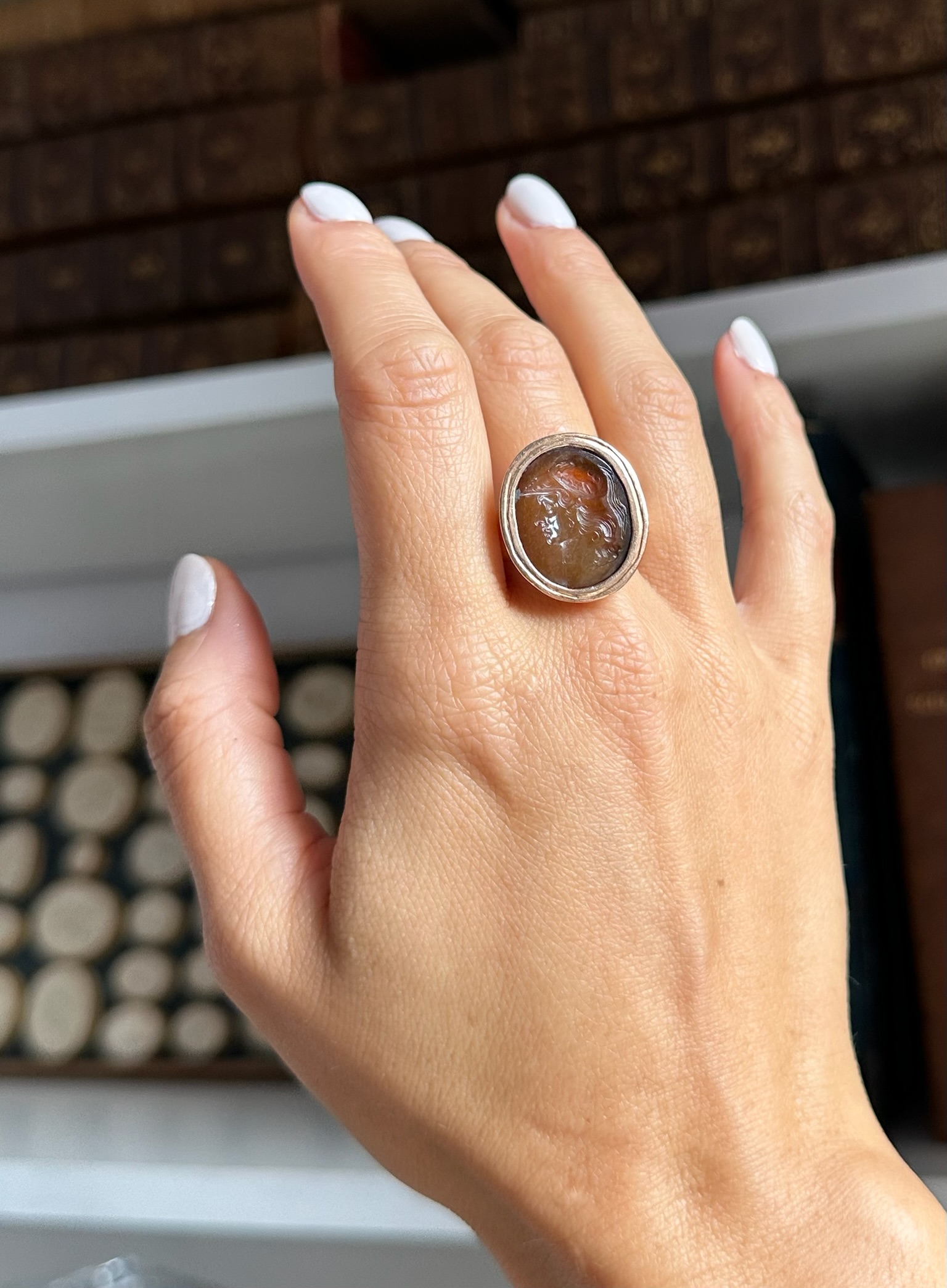 Carlo Costanzi (1705-1781). An Early 18th century sard agate intaglio set in a gold Grand Tour ring. Bust of Alexander the Great.