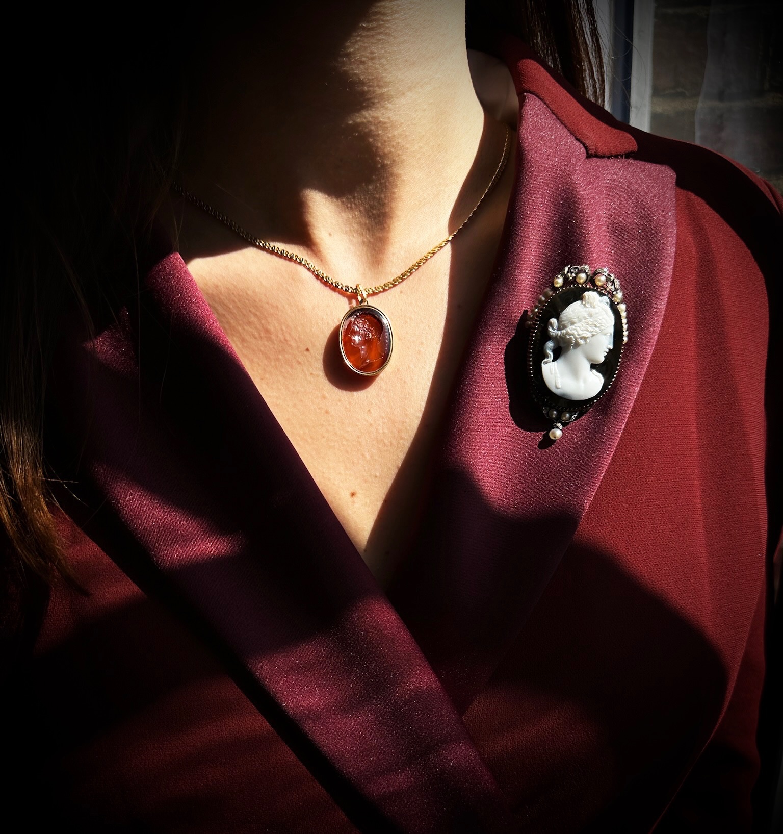 A Neoclassical gold, diamonds and pearls brooch set with an agate cameo signed PESTRINI. (early 19th century)