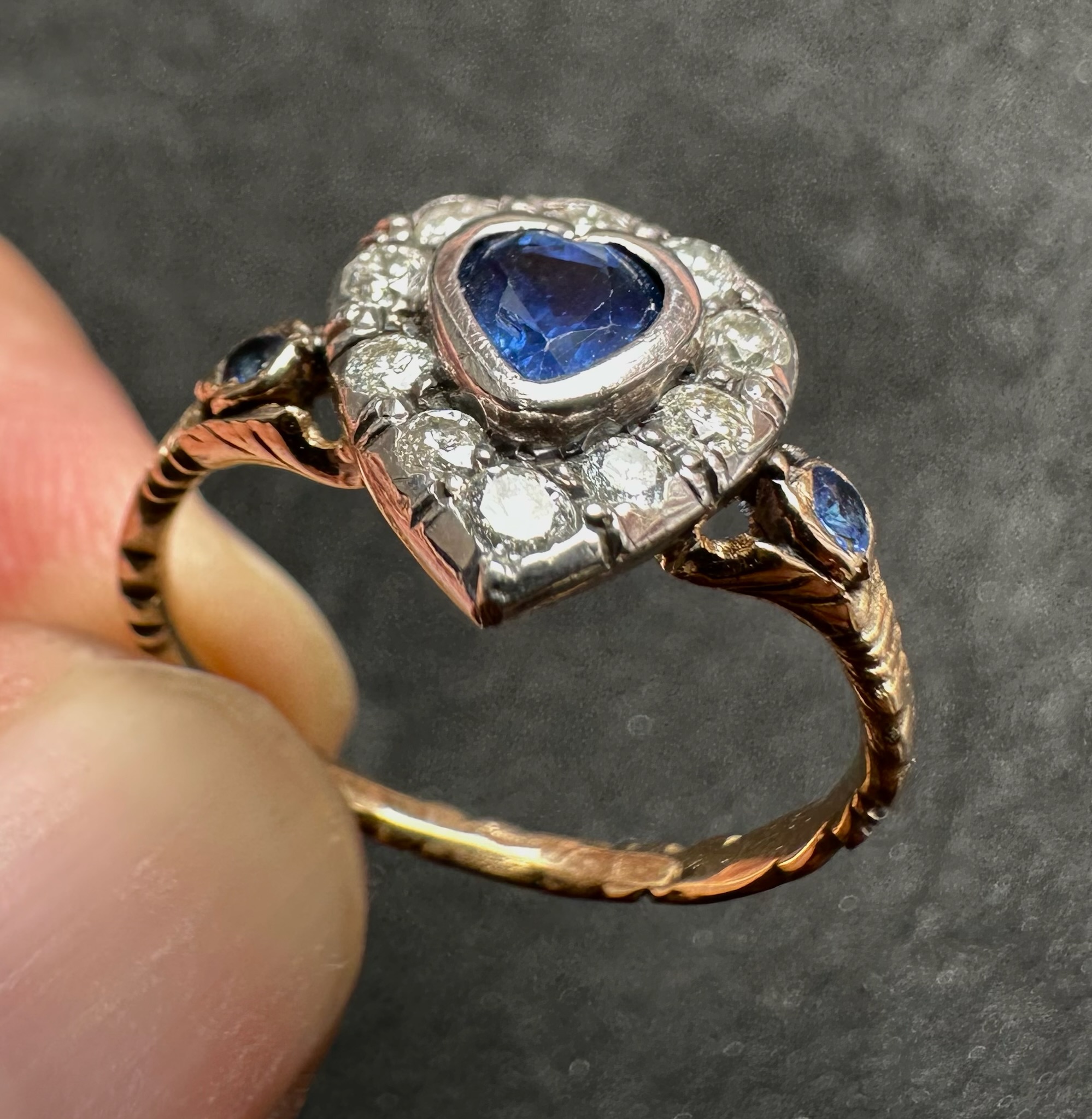 A 19th-century heart-shaped sapphire and diamond ring, gold and silver.