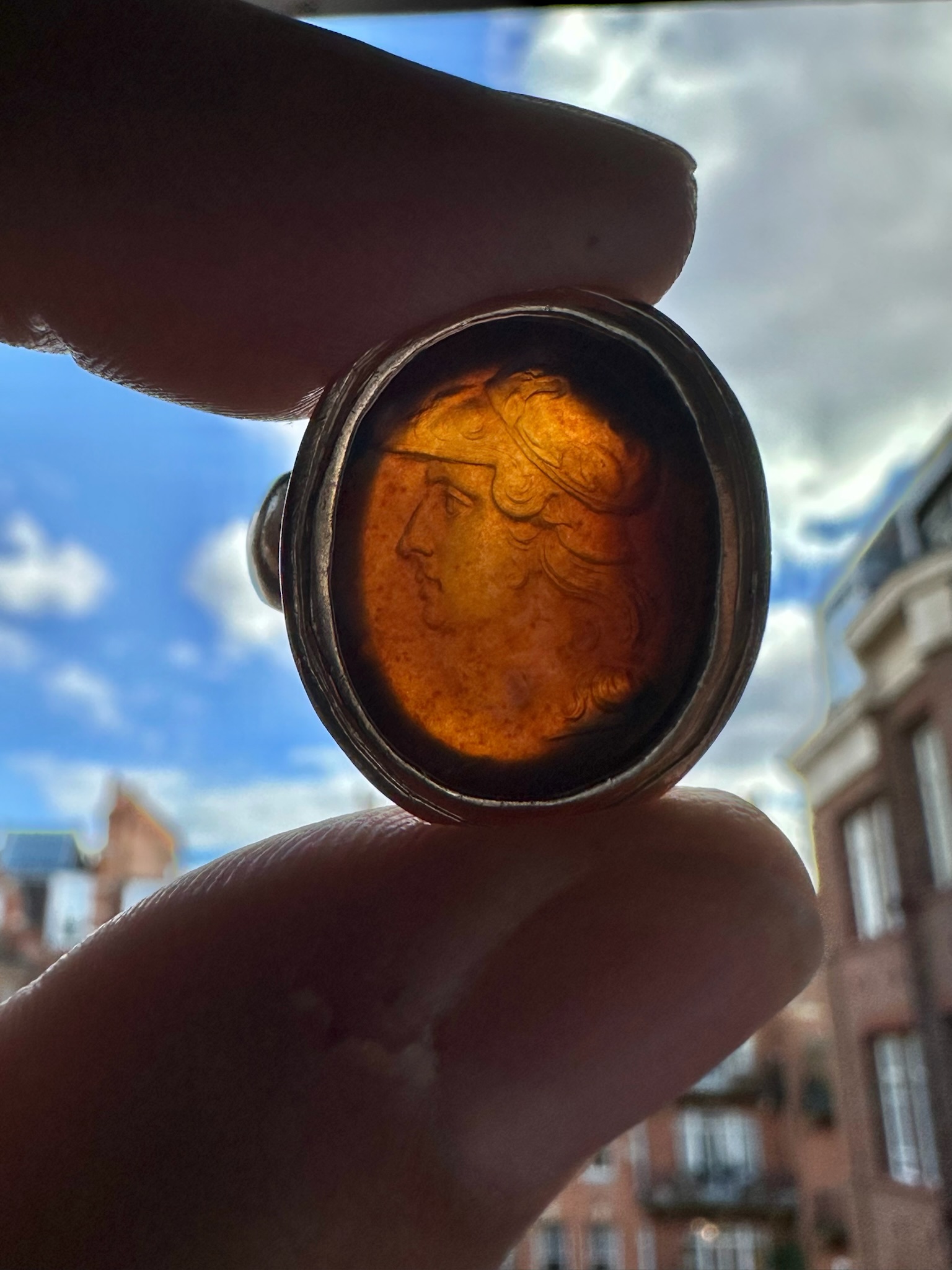 Carlo Costanzi (1705-1781). An Early 18th century sard agate intaglio set in a gold Grand Tour ring. Bust of Alexander the Great.