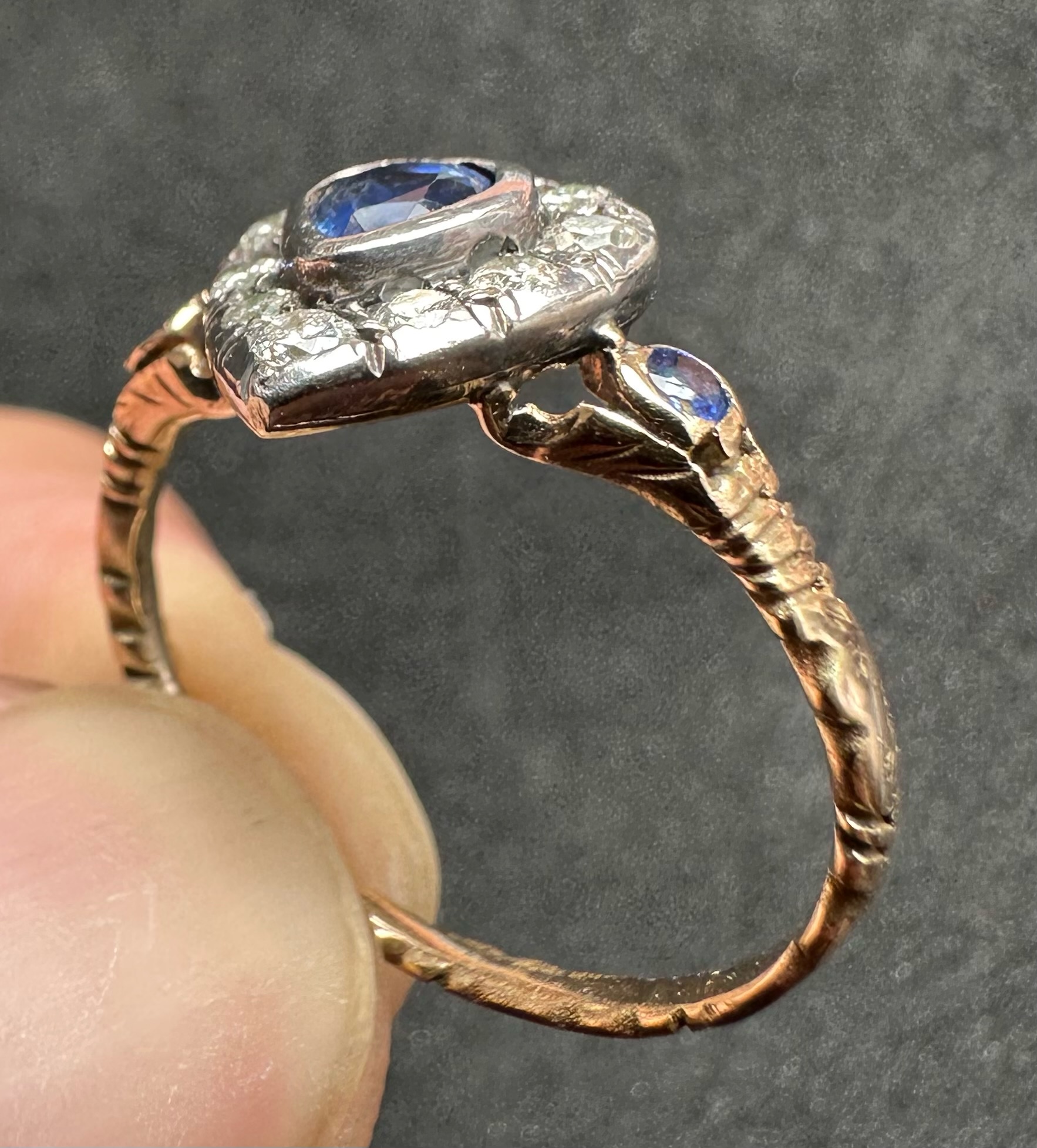 A 19th-century heart-shaped sapphire and diamond ring, gold and silver.