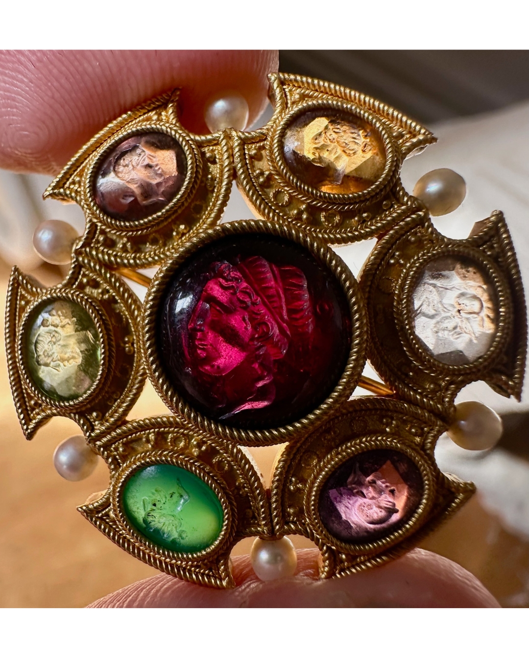 Grand Tour, Attributed to Robert Phillips. An Etruscan Revival gold brooch with intaglios and pearls. (circa 1870)