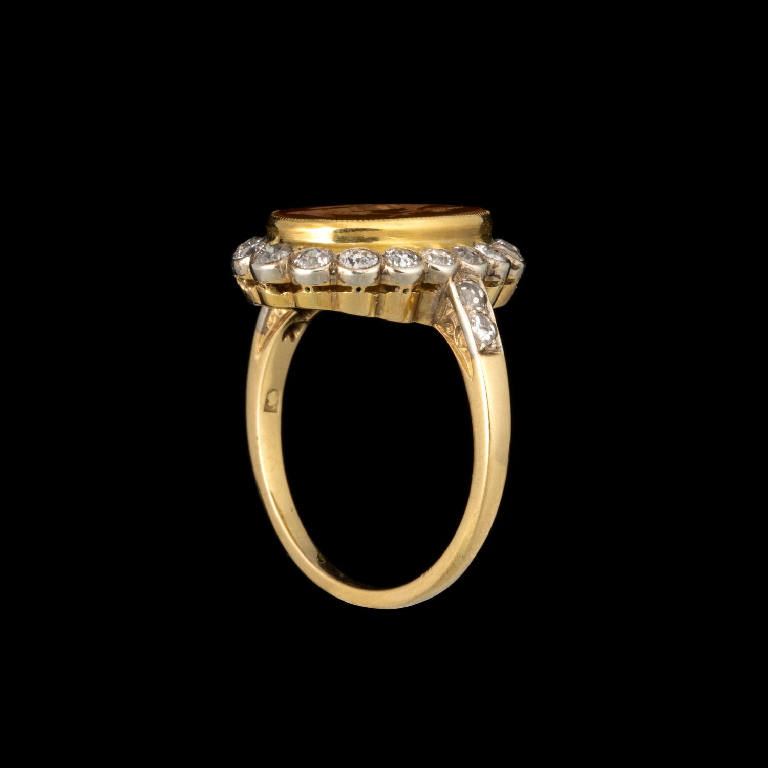 A Vintage two tone gold ring with diamonds and set with a Roman Carnelian Intaglio. Fortuna Tyche.