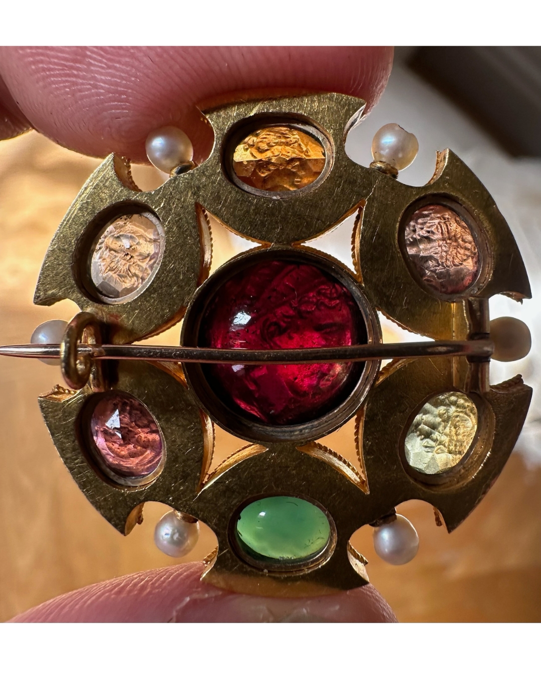 Grand Tour, Attributed to Robert Phillips. An Etruscan Revival gold brooch with intaglios and pearls. (circa 1870)