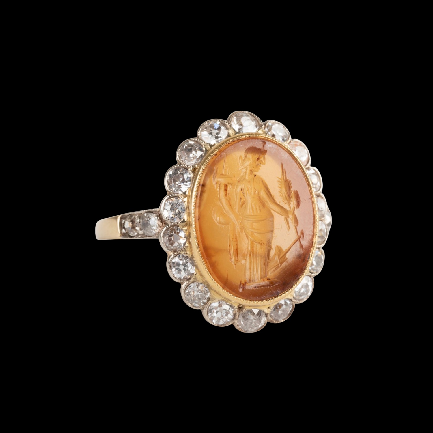 A Vintage two tone gold ring with diamonds and set with a Roman Carnelian Intaglio. Fortuna Tyche.