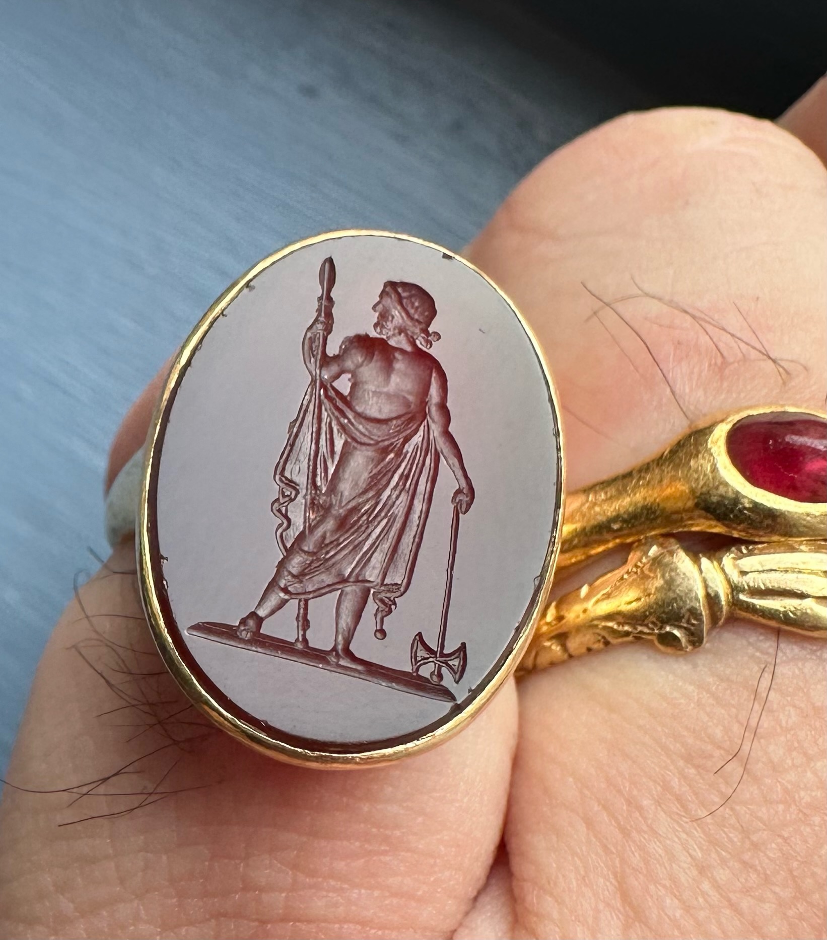 A Neoclassical carnelian intaglio set in an 18k gold ring. Zeus Labraundos, after the Hekatomnid coinage of Halikarnassos.