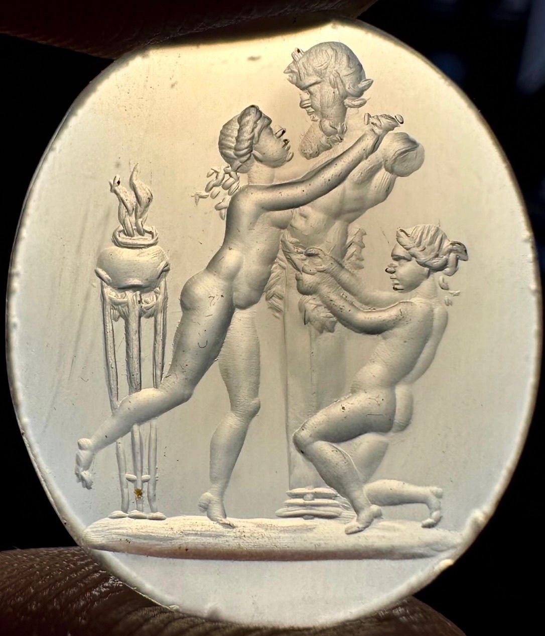A 18th/19th century chalcedony intaglio depicting a priapic scene.