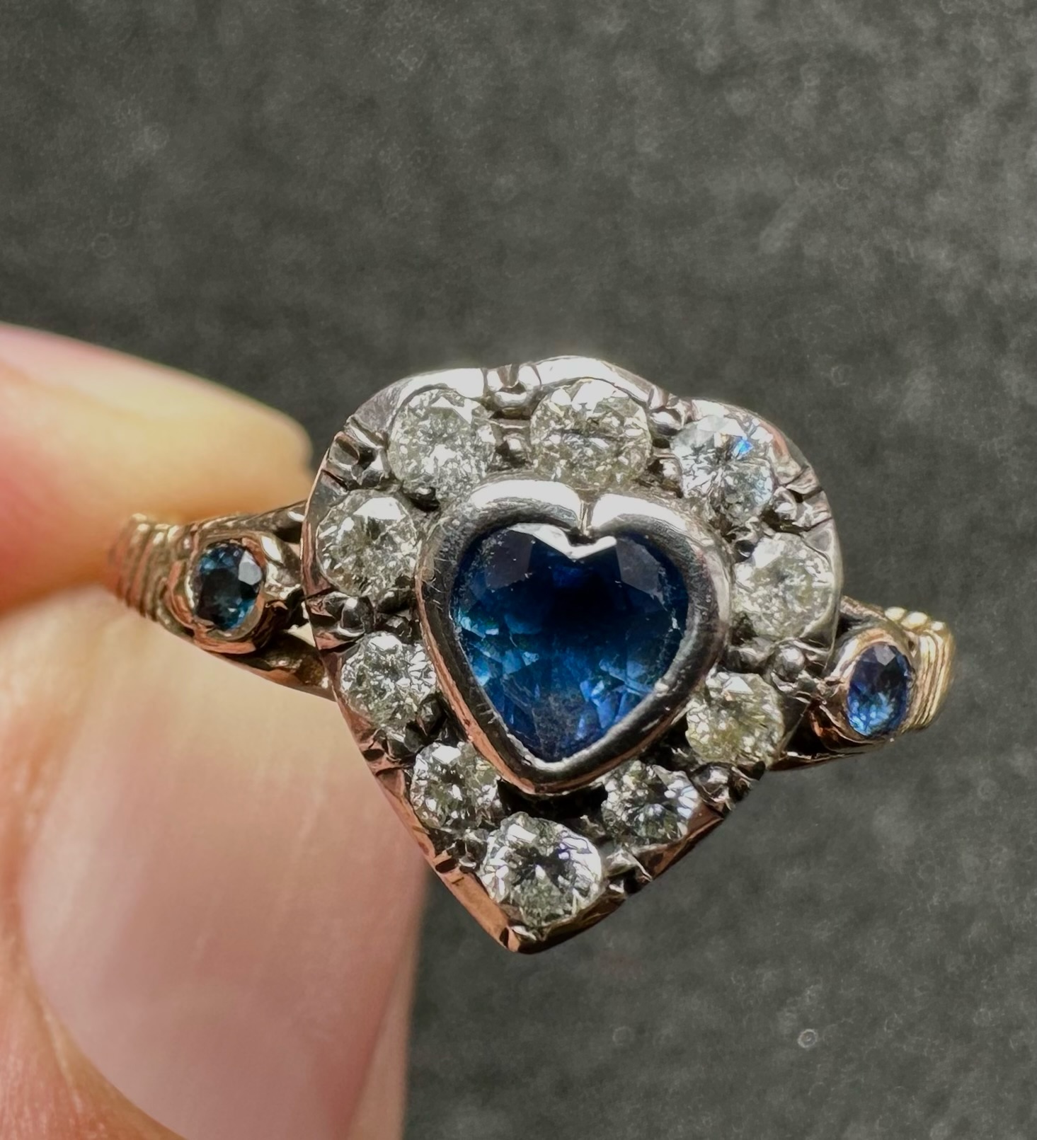 A 19th-century heart-shaped sapphire and diamond ring, gold and silver.