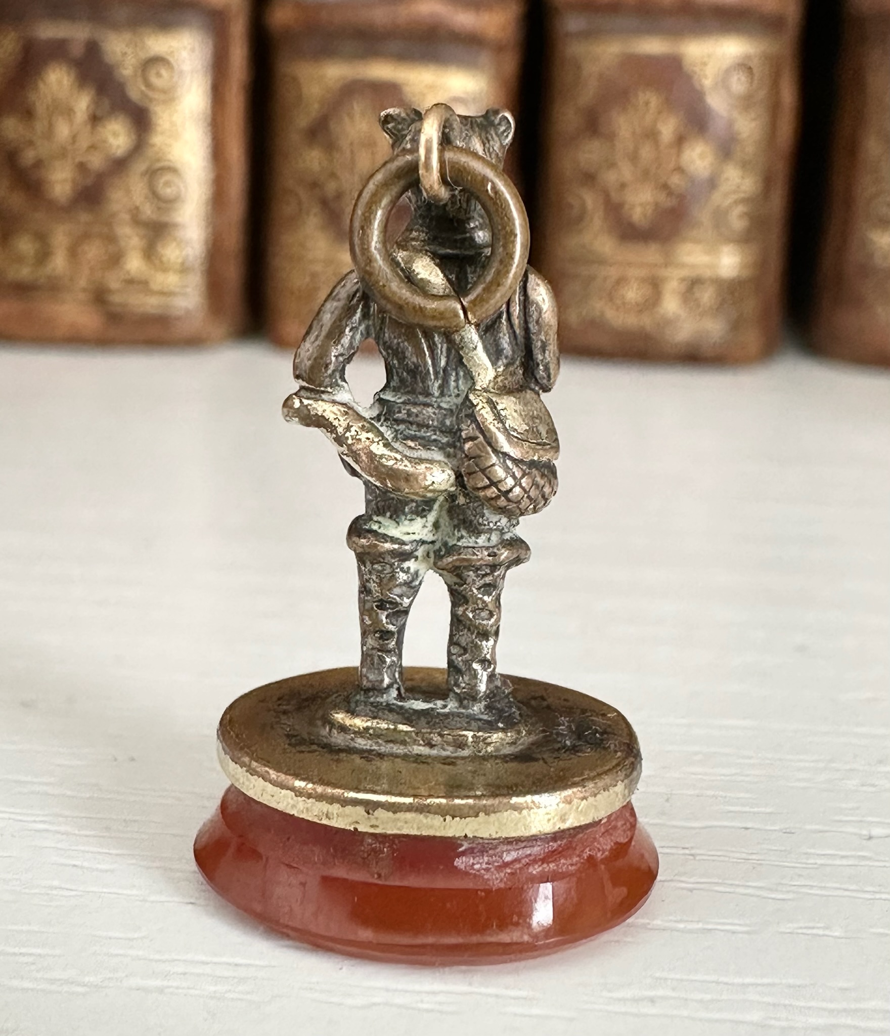 A 19th c. Puss in Boots gilt-metal fob seal with carnelian intaglio "Le diable emporte l'Amour".