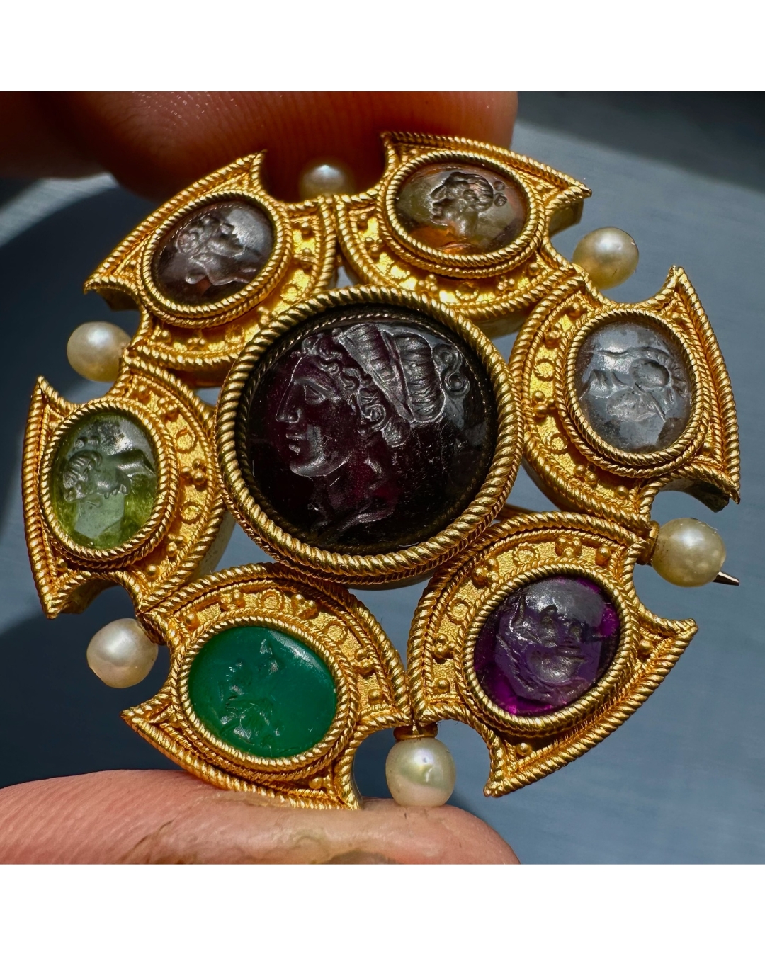 Grand Tour, Attributed to Robert Phillips. An Etruscan Revival gold brooch with intaglios and pearls. (circa 1870)
