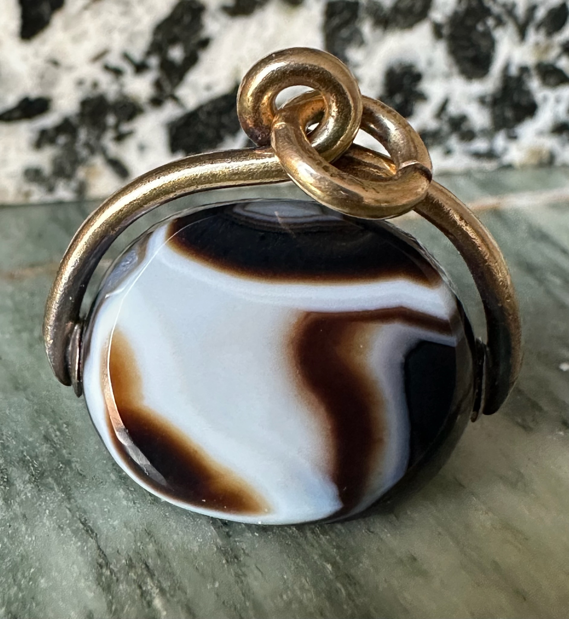 A Victorian banded agate engraved swivel seal with gold mounting. Portrait of Jupiter Ammon