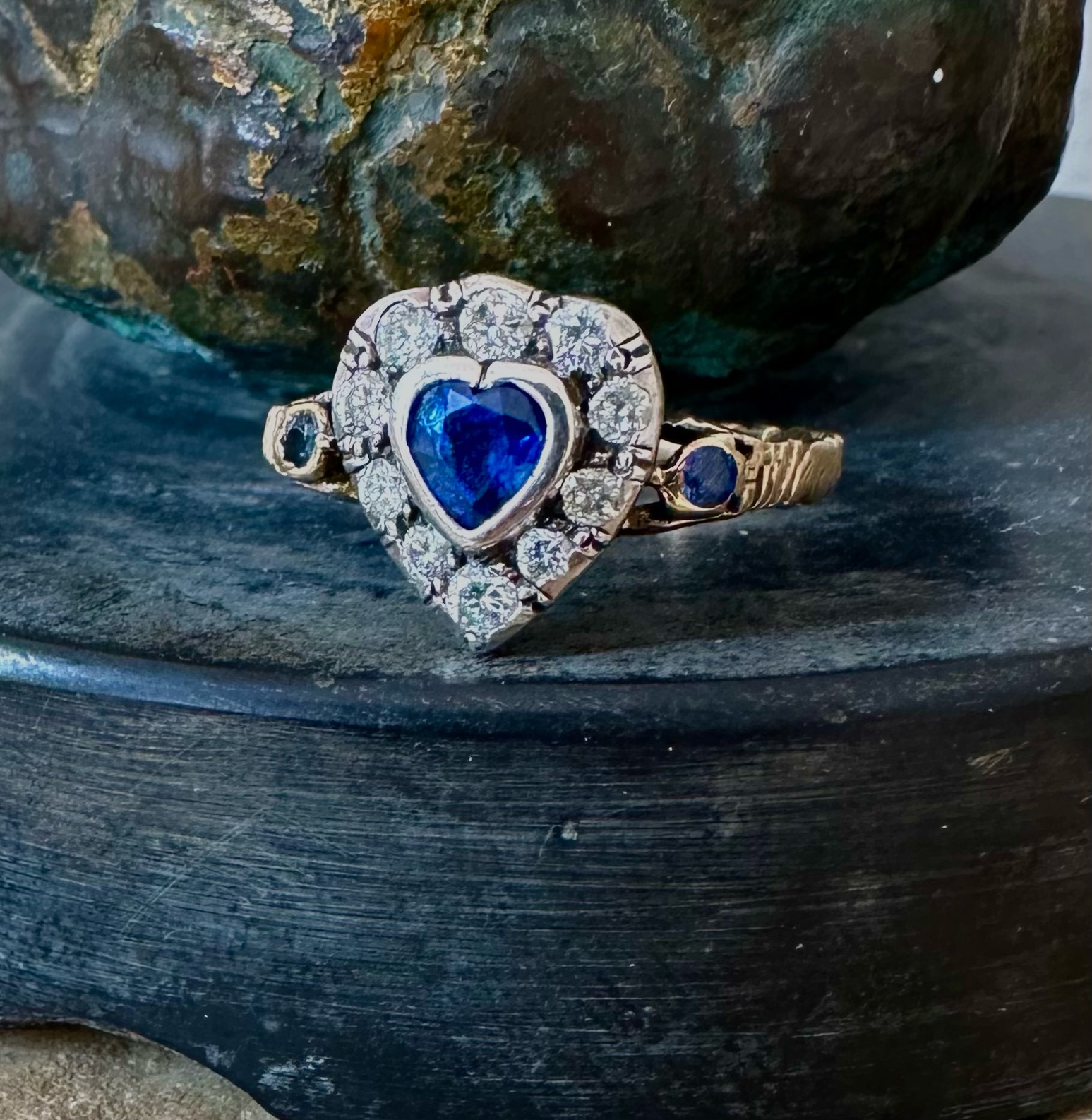 A 19th-century heart-shaped sapphire and diamond ring, gold and silver.
