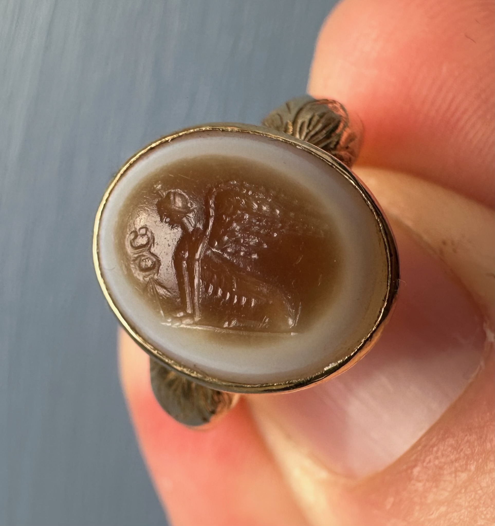 A 19th Century Gold Chiseled Signet Ring set with a Roman Sardonyx Intaglio — Sphinx with Caduceus