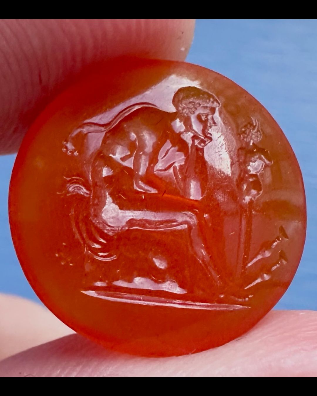 A Grand Tour Carnelian Intaglio A Young Faun Seated before a Herm of Pan