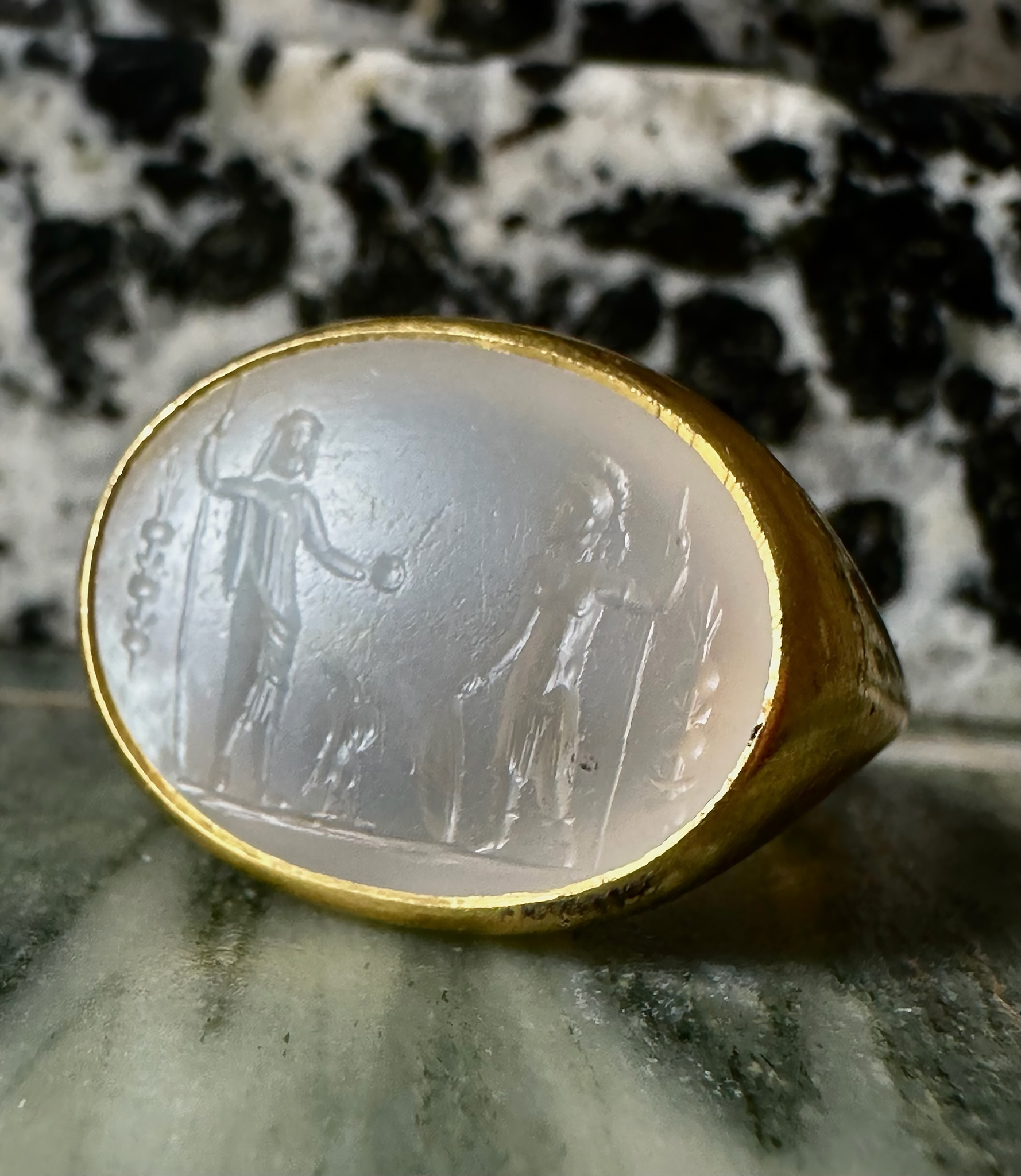 A Large Roman Chalcedony intaglio set in a later massive 22k ring. Jupiter and Mars.