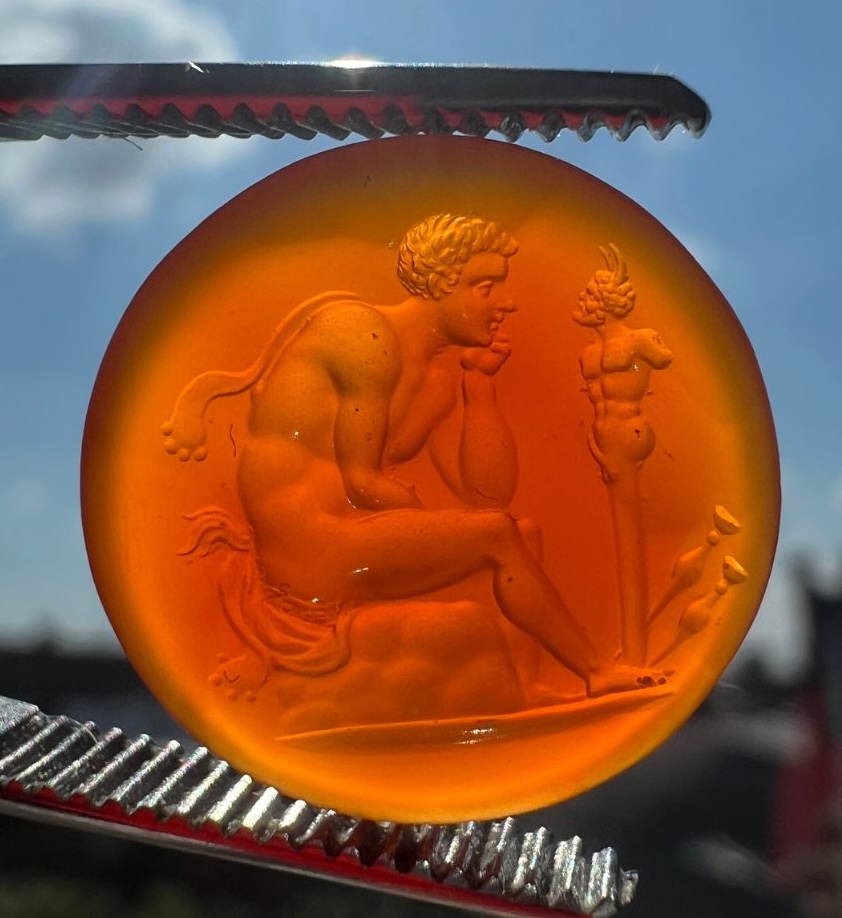 A Grand Tour Carnelian Intaglio A Young Faun Seated before a Herm of Pan