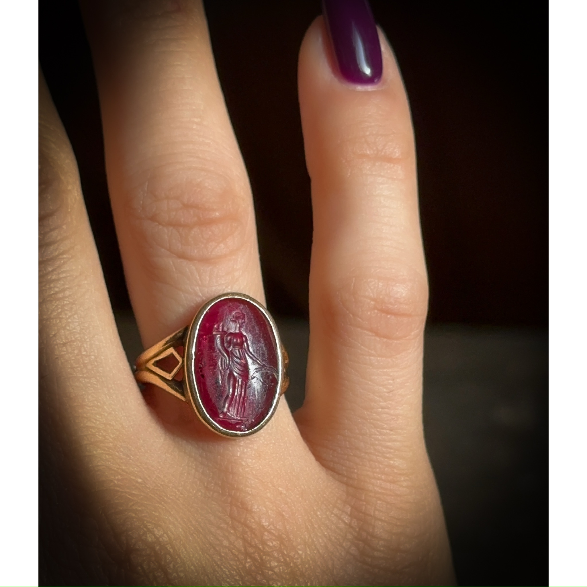 A Greek Late Hellenistic Garnet Intaglio set in a 19th century gold ring. Tyche. 