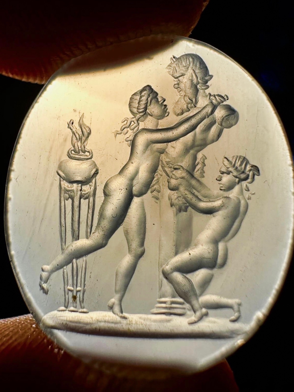 A 18th/19th century chalcedony intaglio depicting a priapic scene.