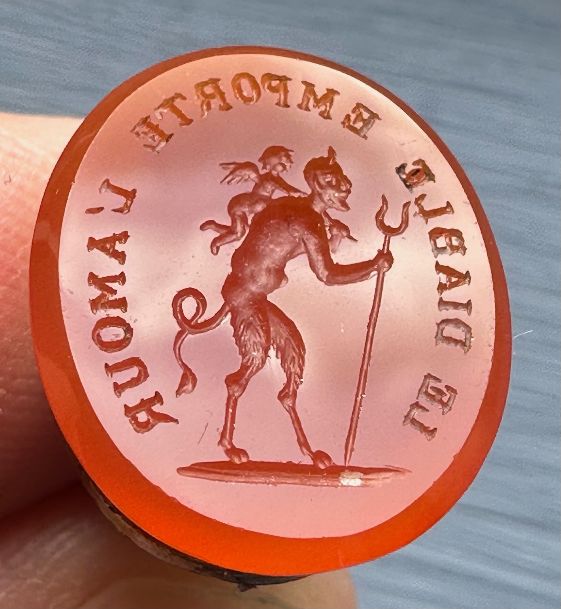 A 19th c. Puss in Boots gilt-metal fob seal with carnelian intaglio "Le diable emporte l'Amour".