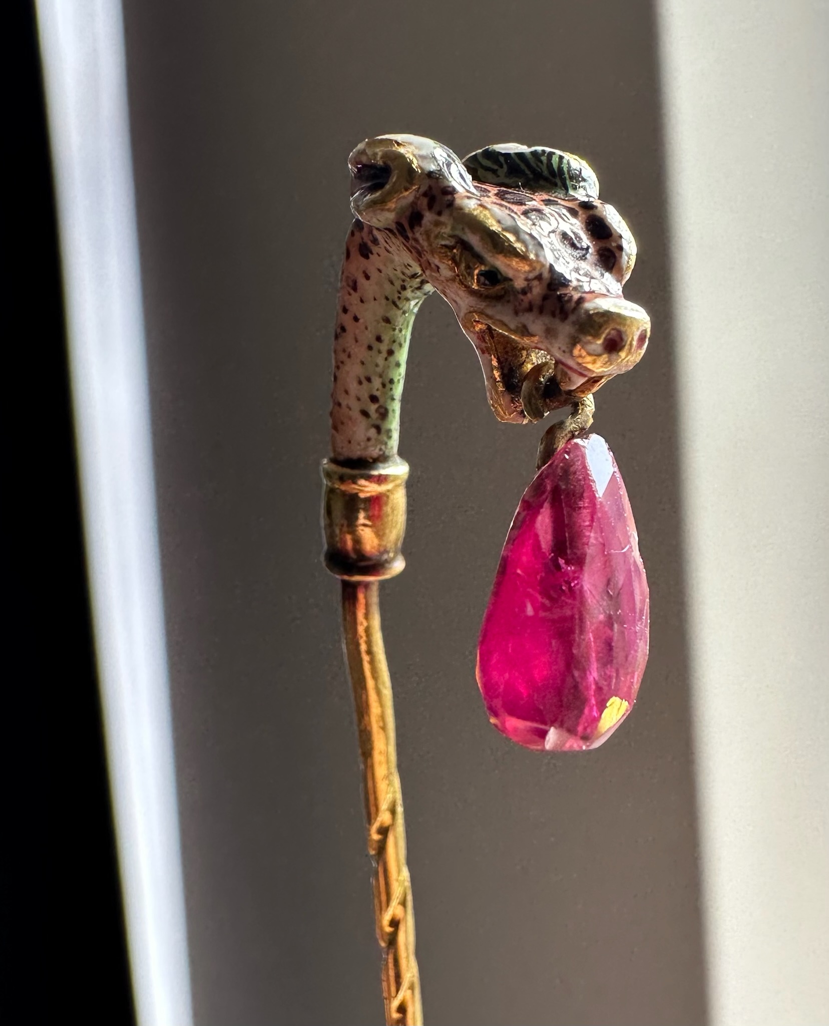 19th century, A 19th century gold stick pin with a Renaissance gold and enamel leopard head with Burmese ruby. 