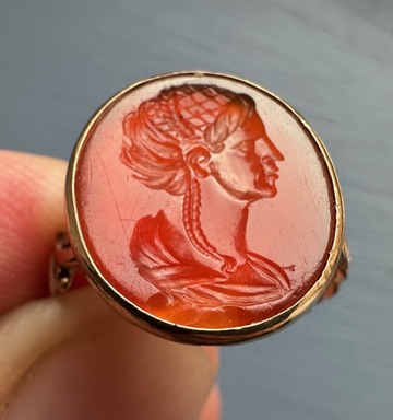 A Grand Tour carnelian intaglio gold ring, portrait of a Roman matrona