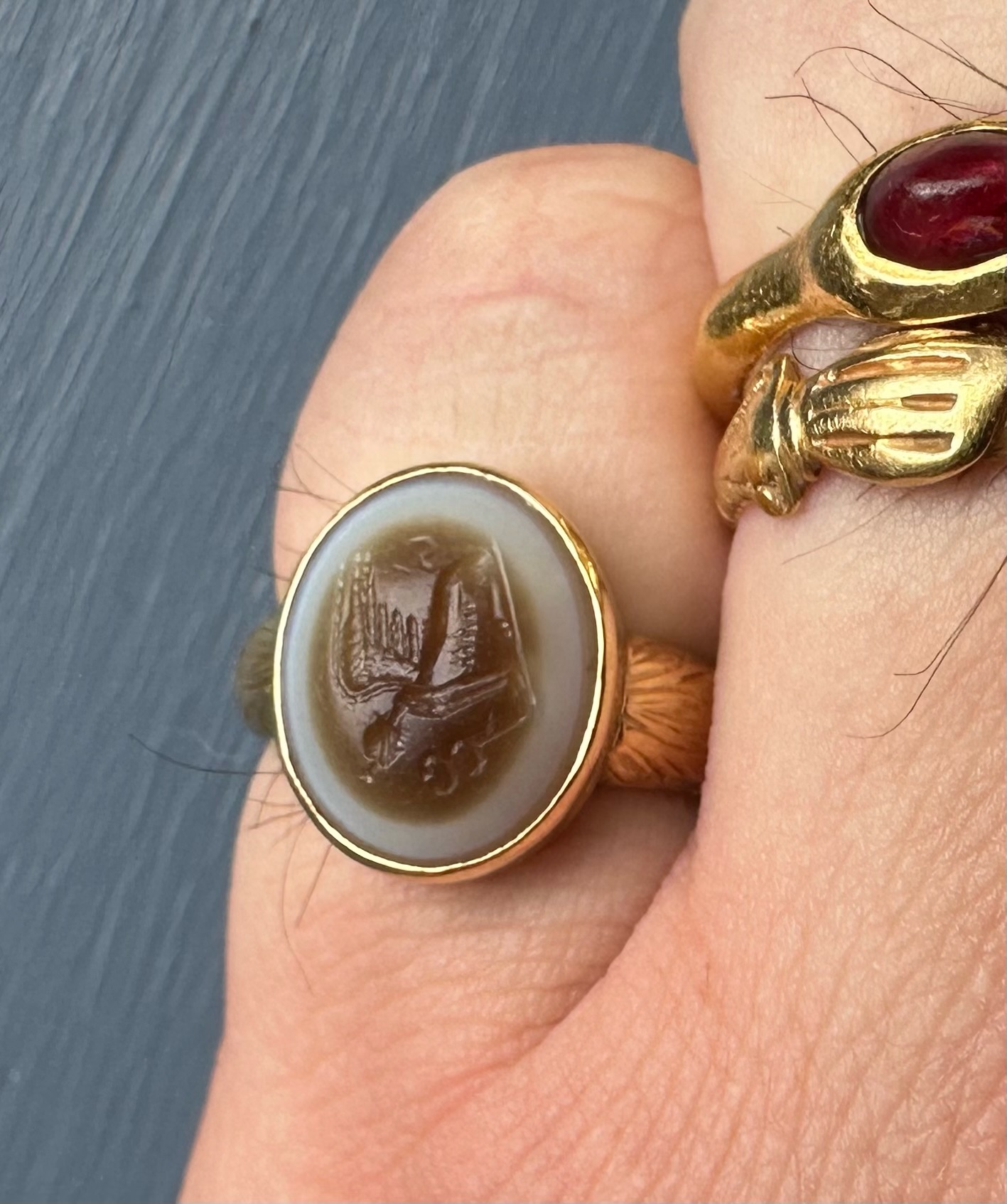 A 19th Century Gold Chiseled Signet Ring set with a Roman Sardonyx Intaglio — Sphinx with Caduceus