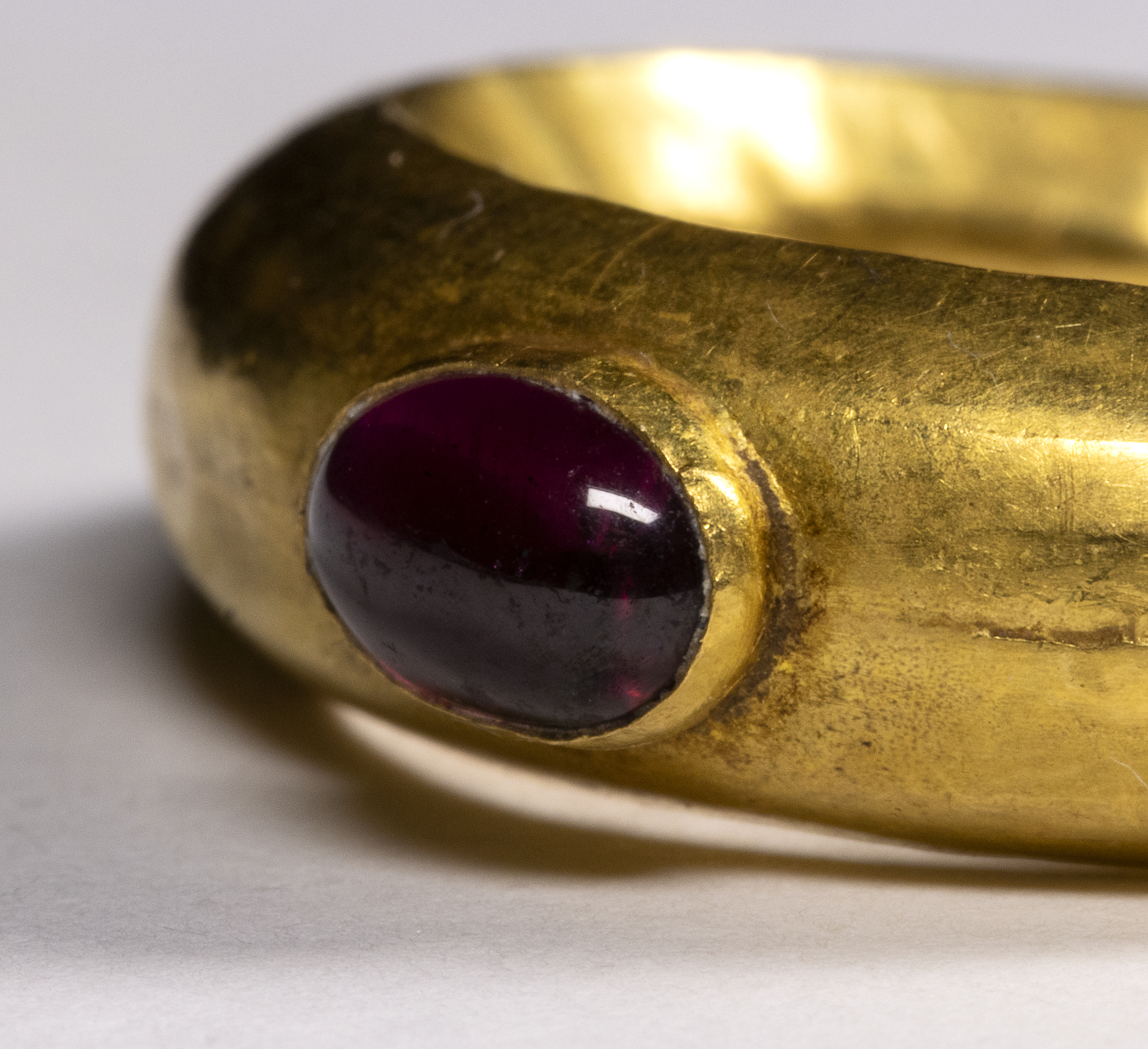 A Roman Gold and Garnet Cabochon ring.