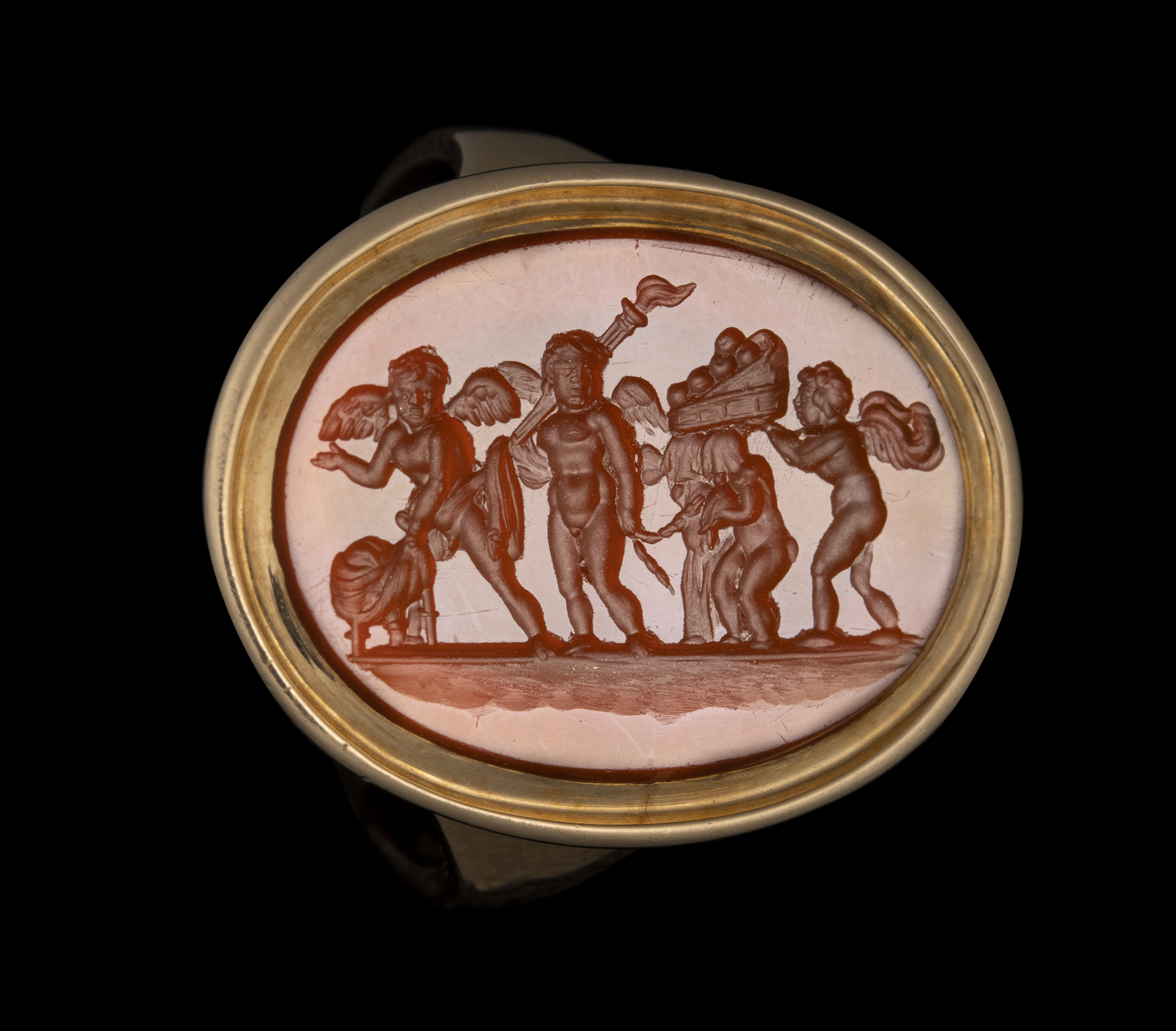 A Late 18th century gold ring set with a carnelian intaglio. The Mariage of Love and Psyche.