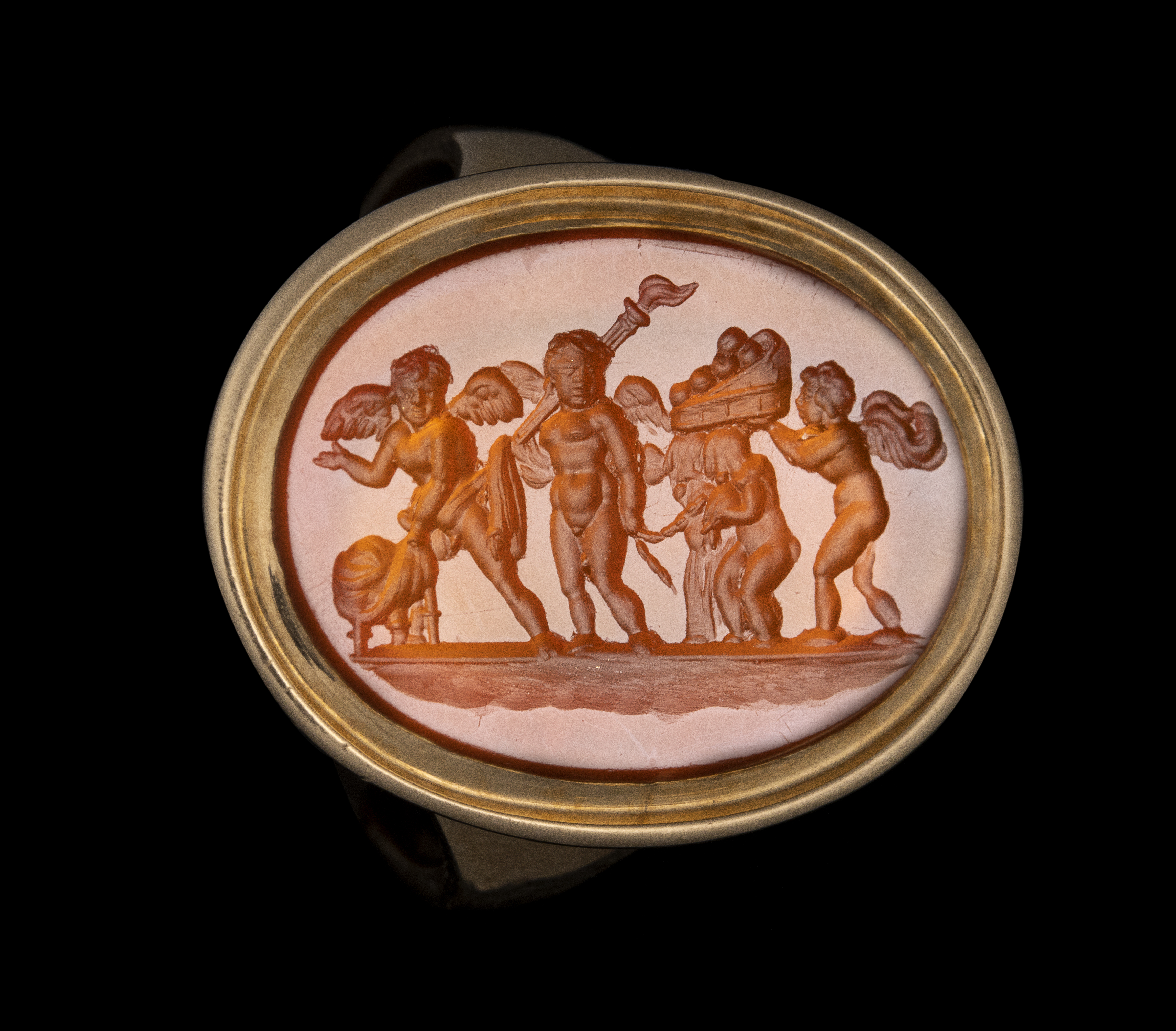 A Late 18th century gold ring set with a carnelian intaglio. The Mariage of Love and Psyche.