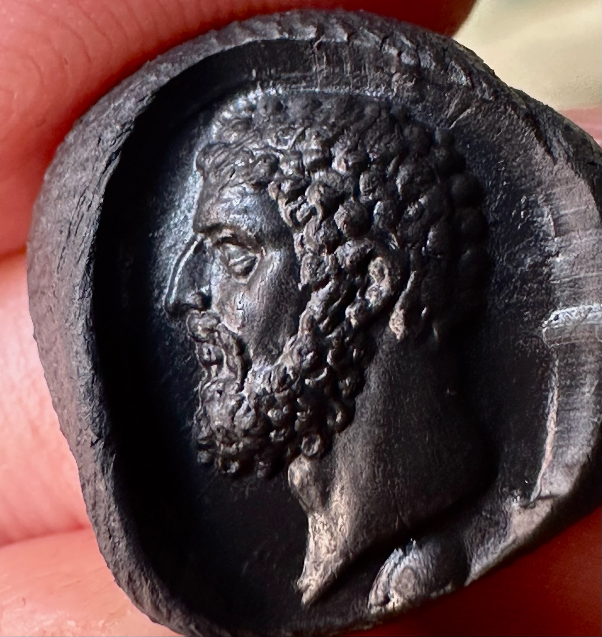 A Roman imperial carnelian intaglio. Portrait of Hercules.