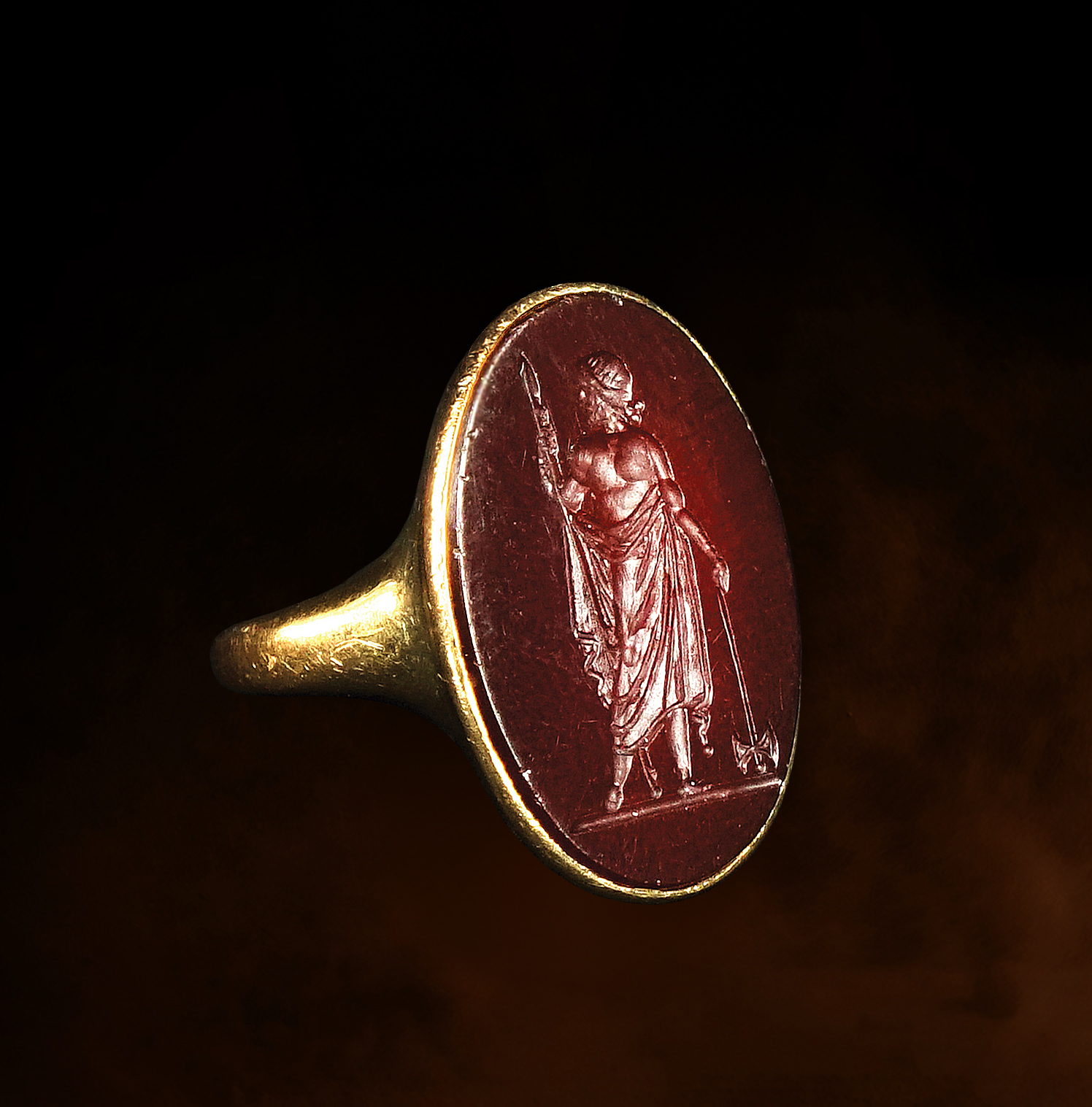 A Neoclassical carnelian intaglio set in an 18k gold ring. Zeus Labraundos, after the Hekatomnid coinage of Halikarnassos.
