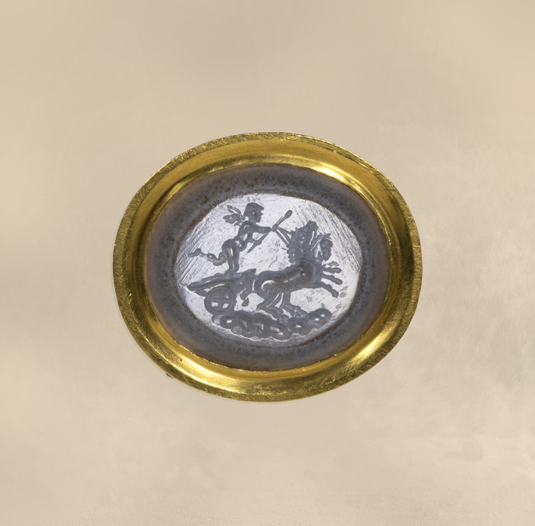 A Neoclassical chalcedony intaglio set in a 22k gold ring. The Conquest of Love.
