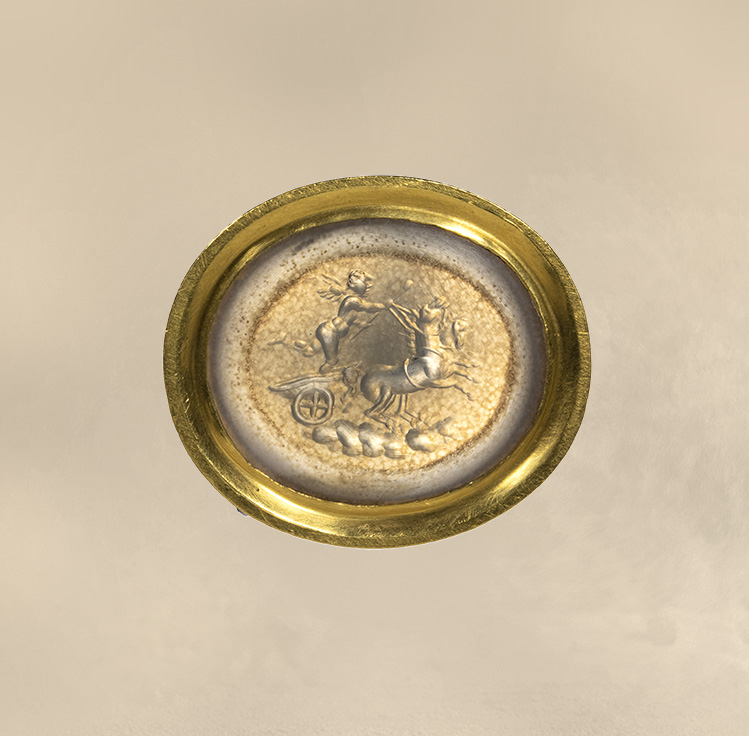 A Neoclassical chalcedony intaglio set in a 22k gold ring. The Conquest of Love.