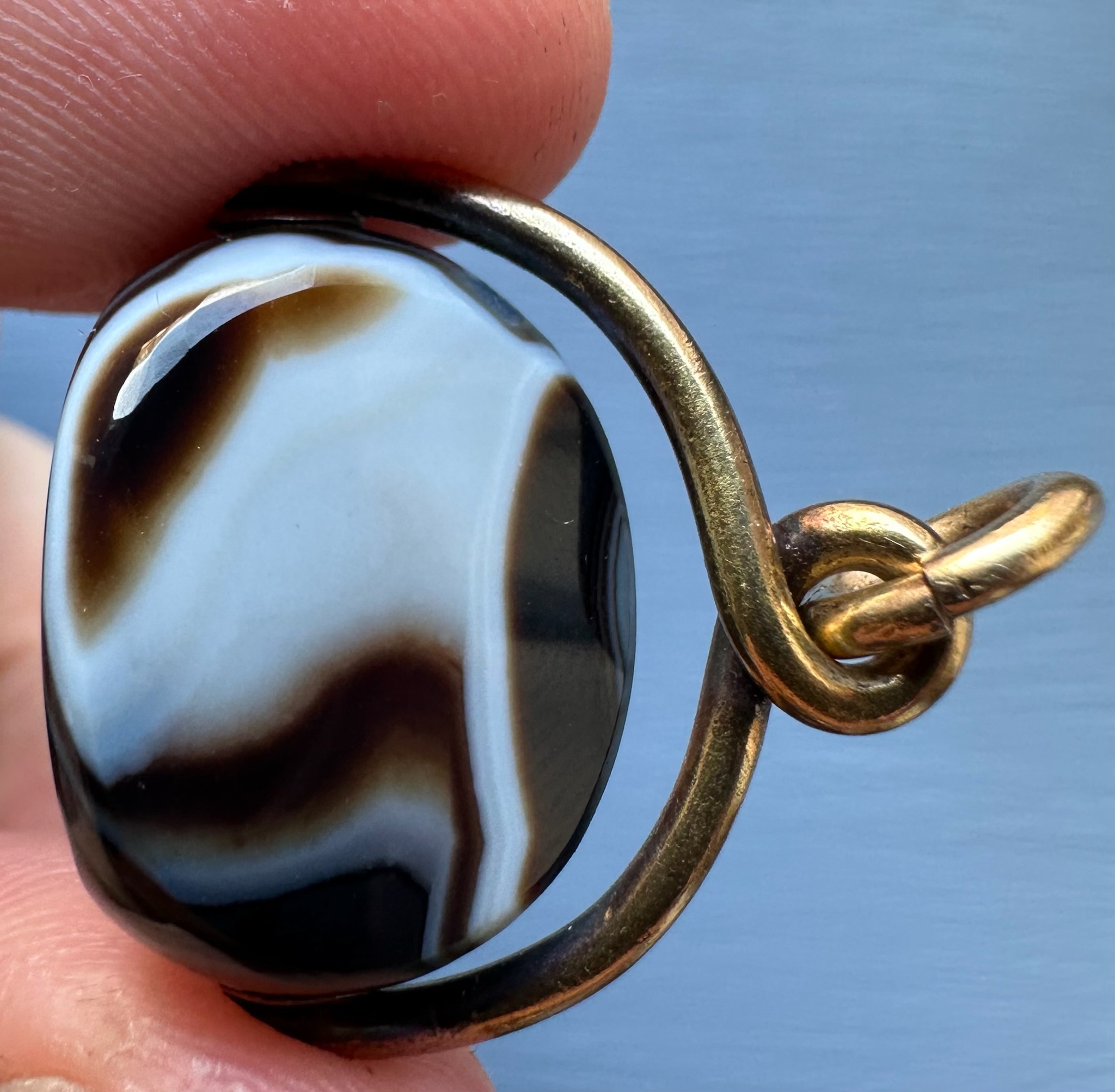A Victorian banded agate engraved swivel seal with gold mounting. Portrait of Jupiter Ammon
