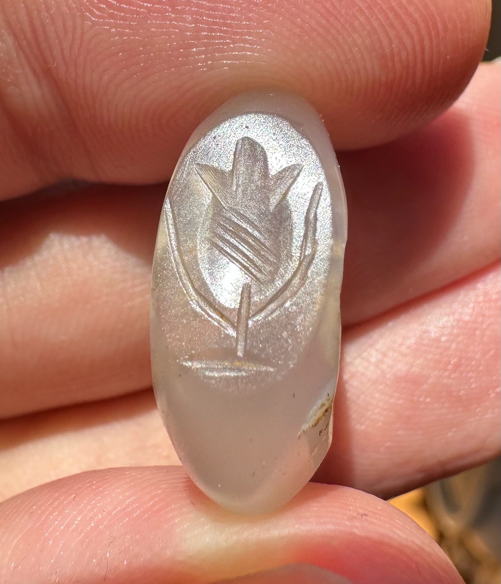 A Sasanian hololithic chalcedony seal ring. Flower.