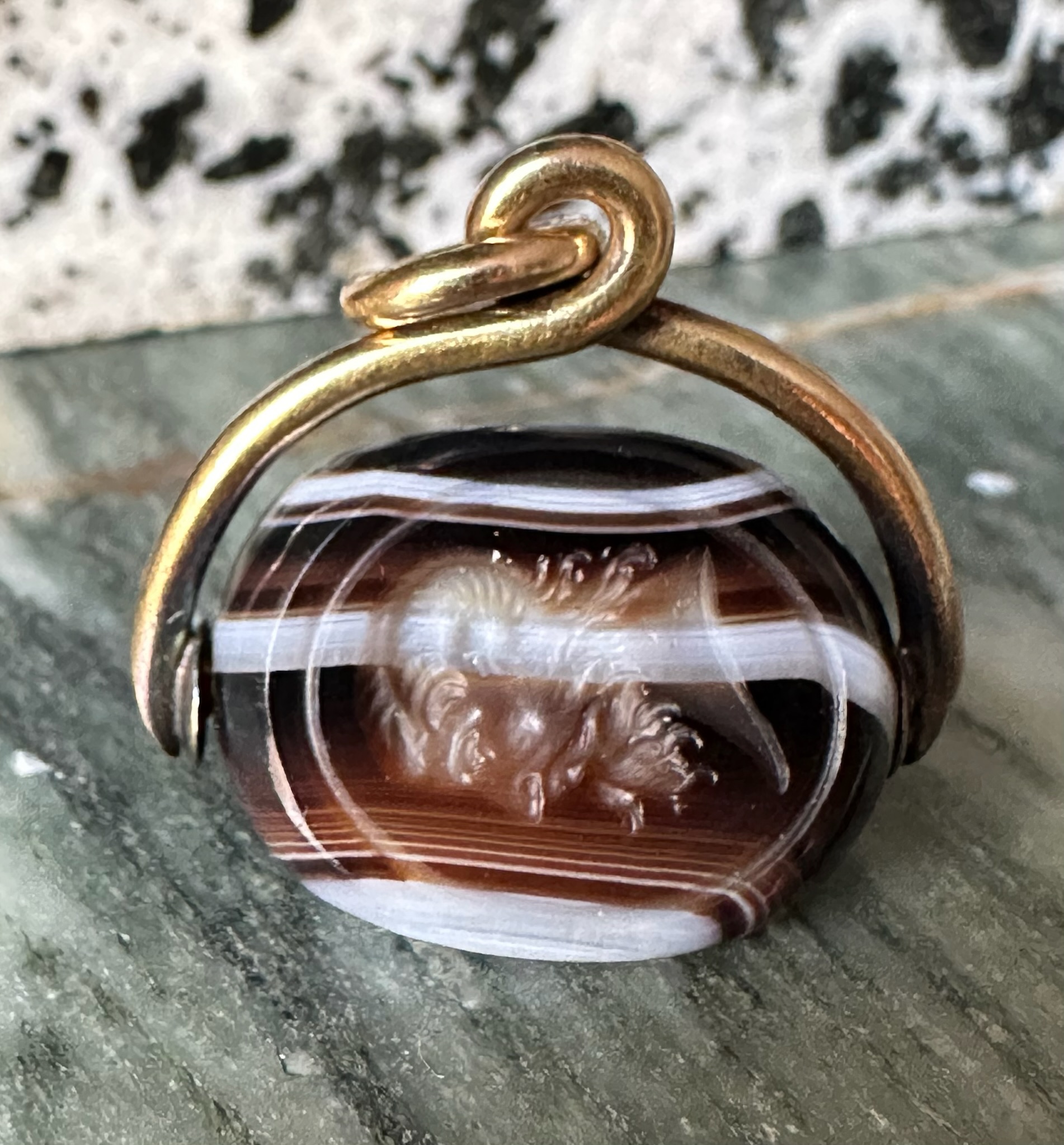 A Victorian banded agate engraved swivel seal with gold mounting. Portrait of Jupiter Ammon