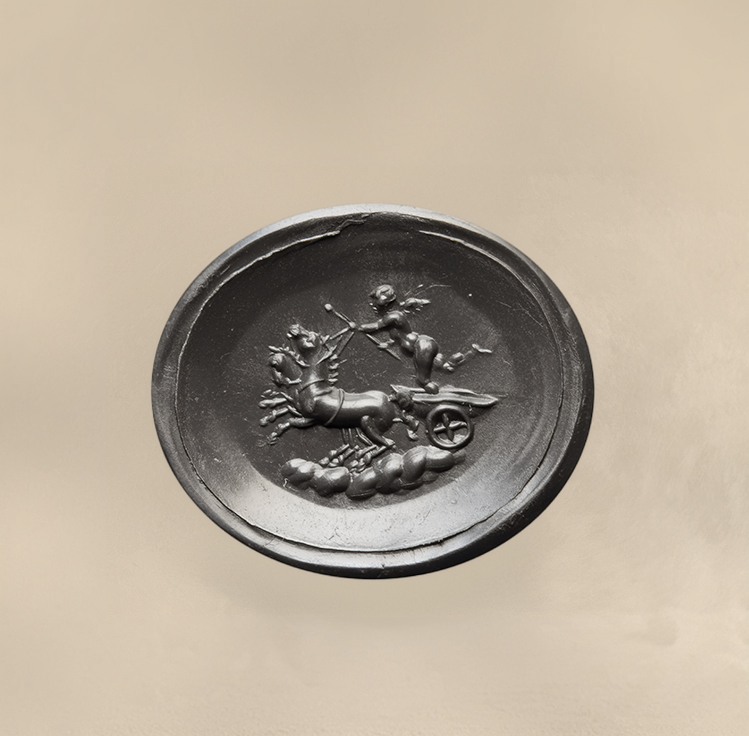 A Neoclassical chalcedony intaglio set in a 22k gold ring. The Conquest of Love.