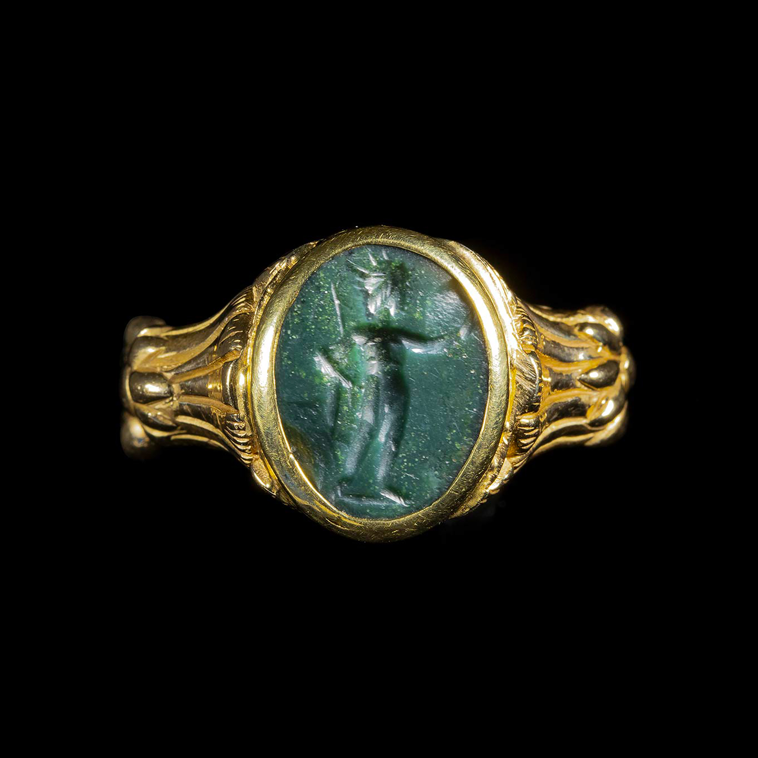 A gold ring set with a Roman green jasper intaglio. Helios.