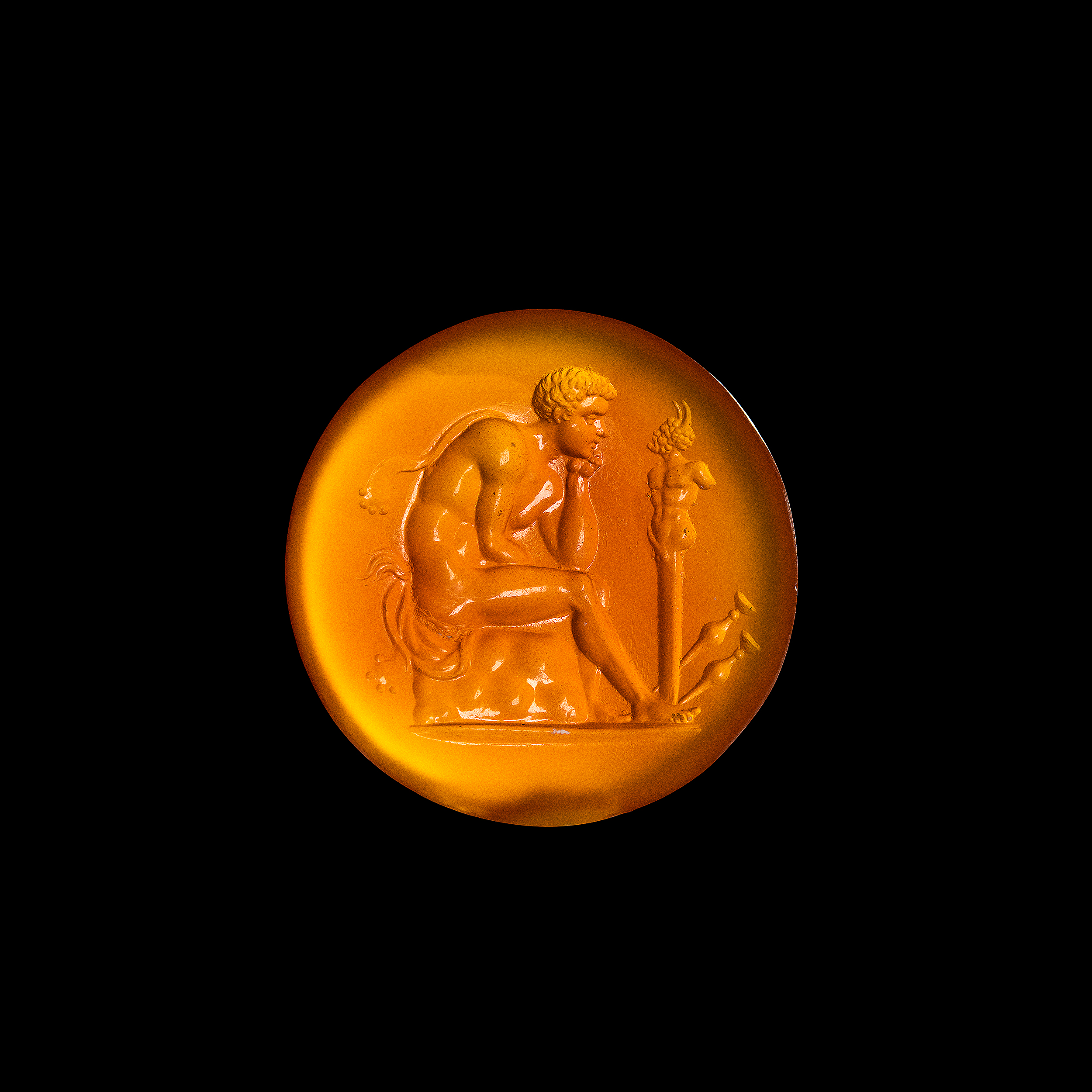 A Grand Tour Carnelian Intaglio A Young Faun Seated before a Herm of Pan