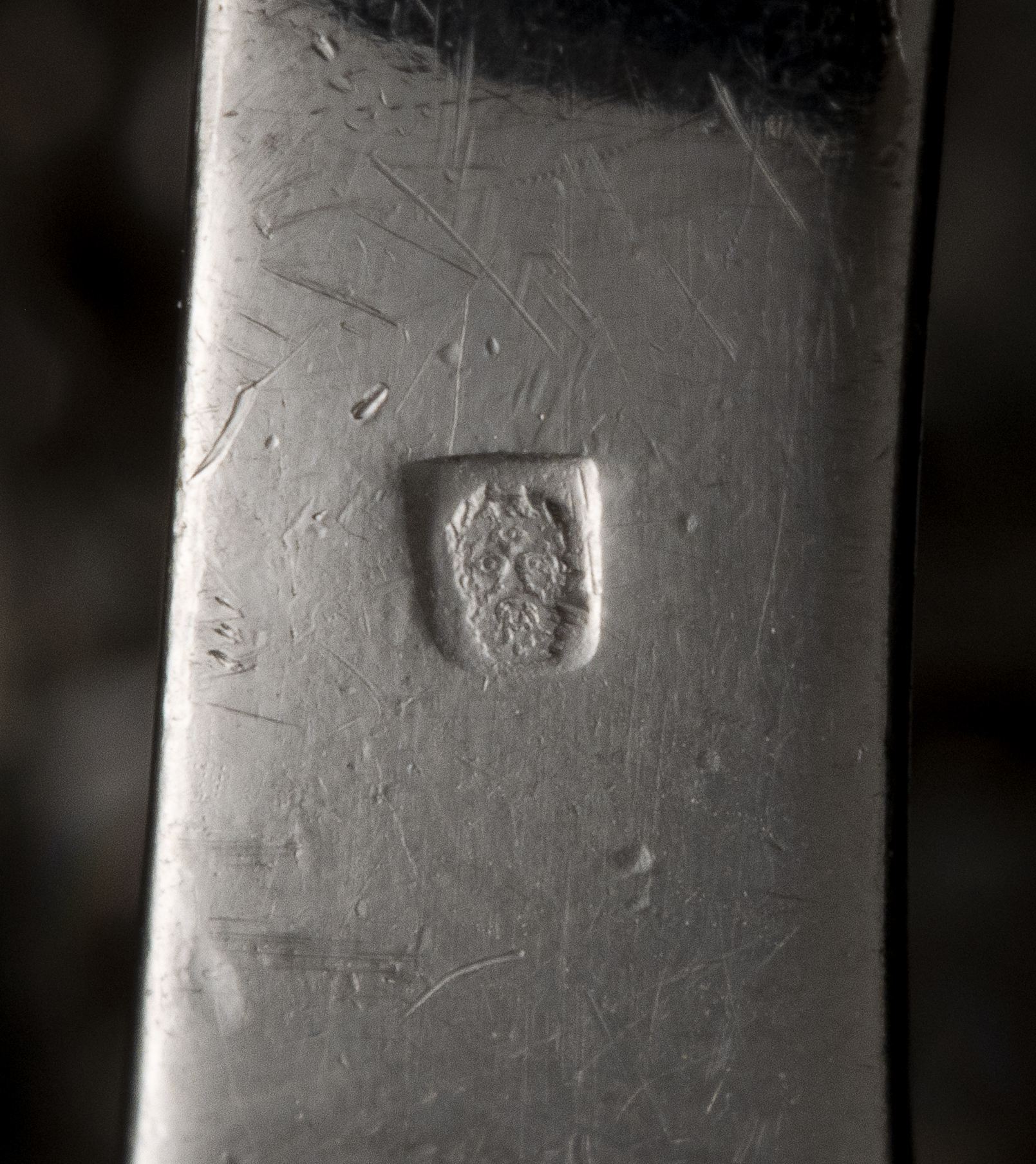 A diamond and platinum ring, set with a rectangular shaped emerald (ca. 1960)