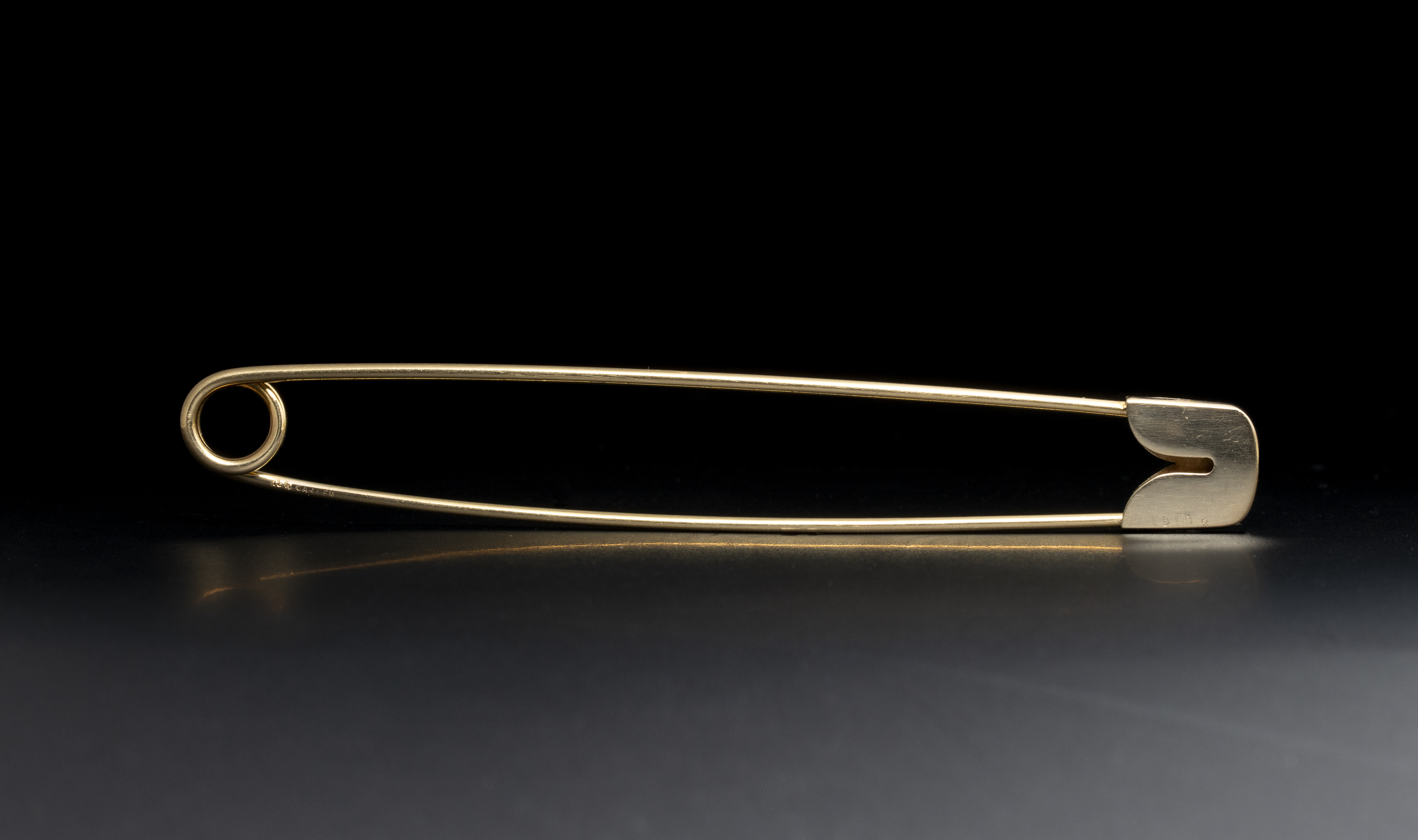 CARTIER 1960 NEW YORK. A 18k Yellow Gold Safety Pin Brooch