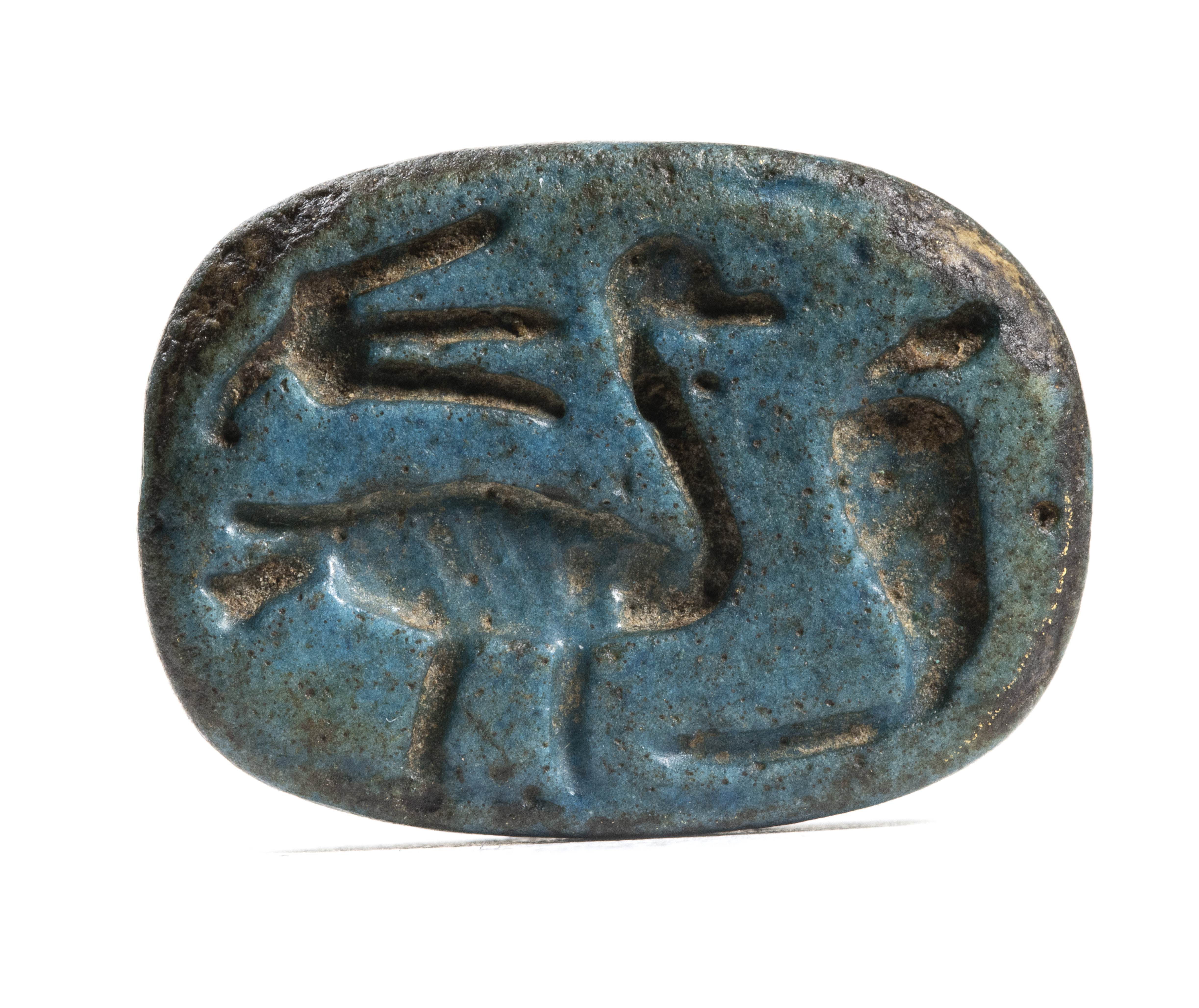 New-Kingdom, A New-Kingdom blue faience scaraboid engraved seal. (1550-1070 BCE)