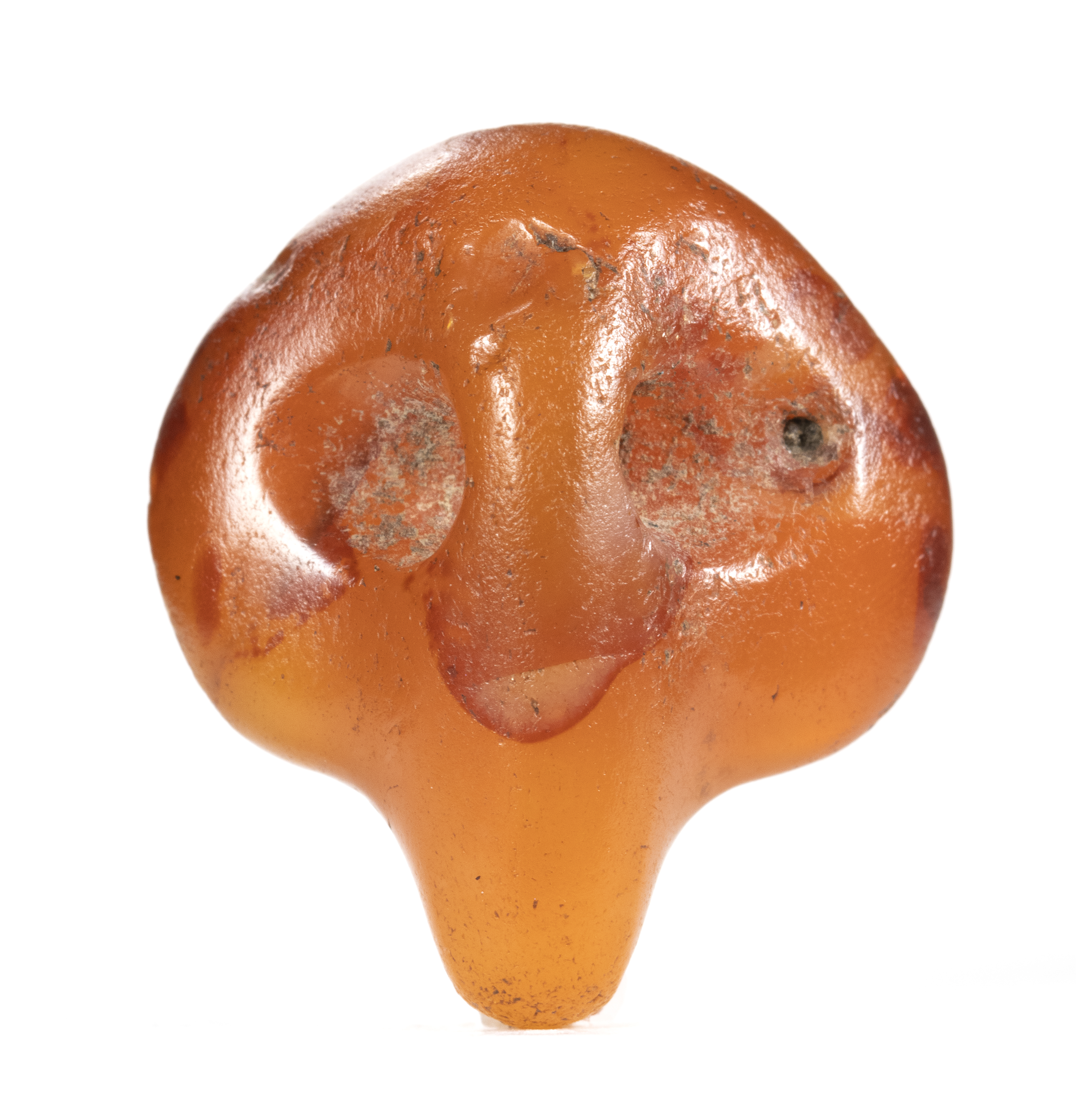 Predynastic, Naqada culture, A rare Predynastic carnelian 'Bull's head' pendant amulet.  (2nd half of the 4th millennium B.C.)