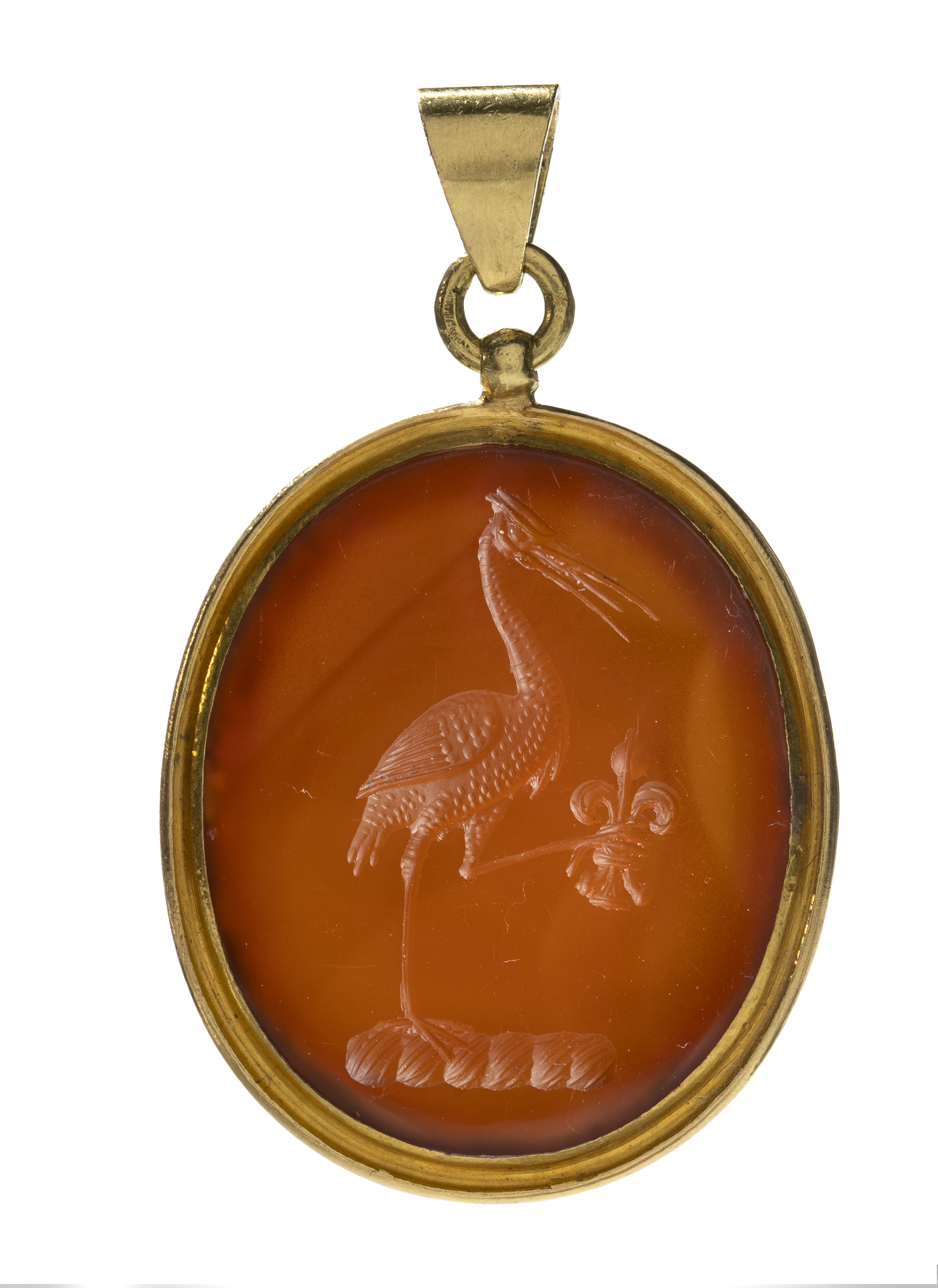 Neoclassical, A gold pendant set with a Neoclassical carnelian intaglio. Allegorical scene with a crane. (Early 19th century)