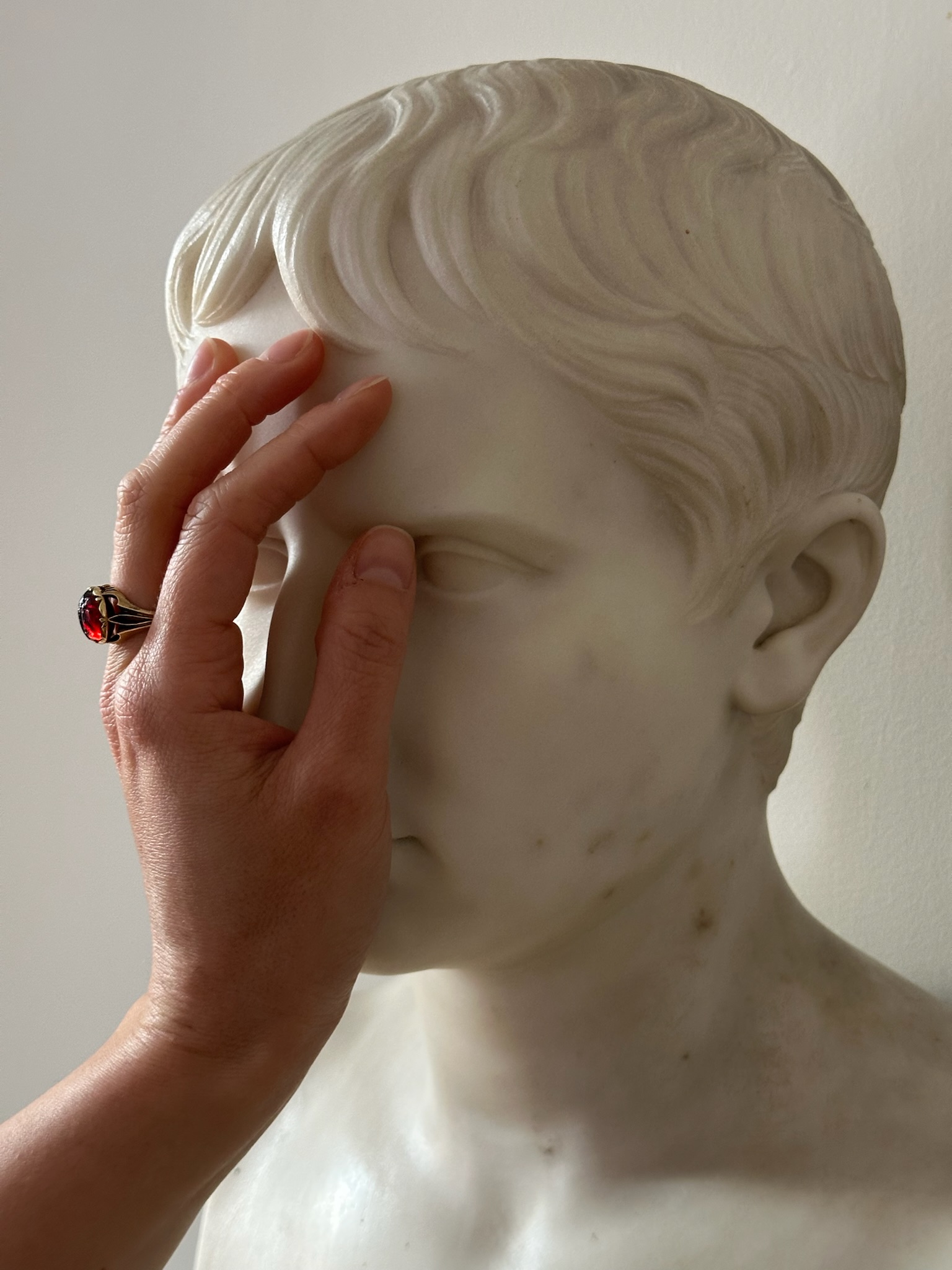 A 19th century gold ring set with an early Roman garnet intaglio. Victory. 