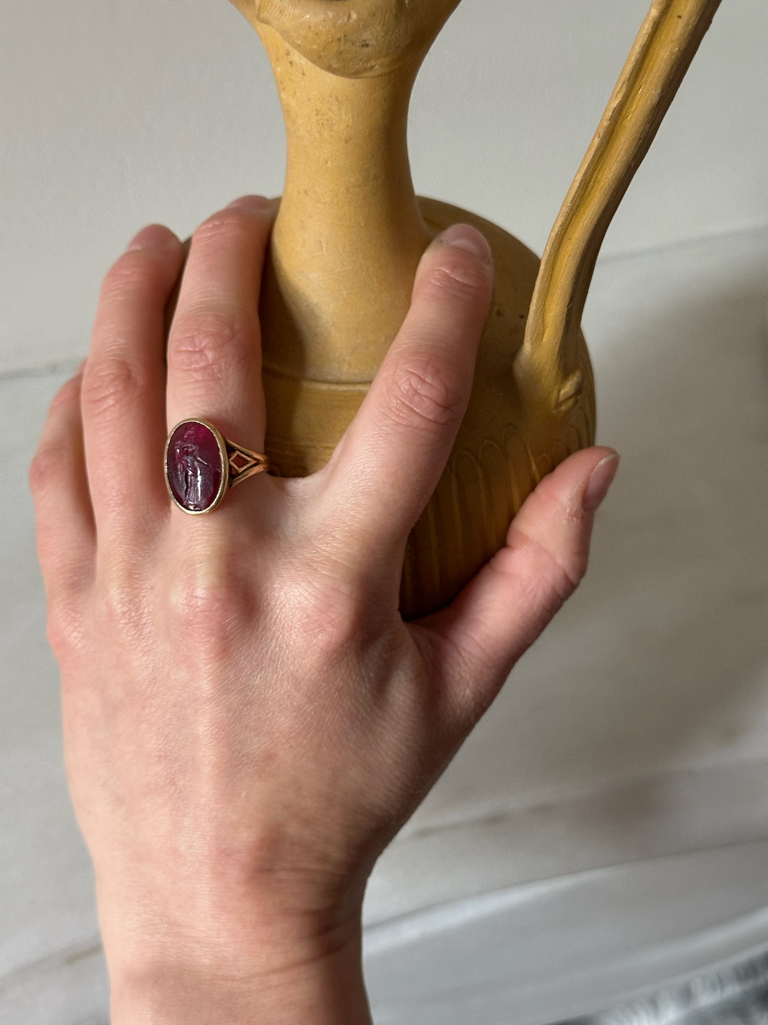 A Greek Late Hellenistic Garnet Intaglio set in a 19th century gold ring. Tyche. 