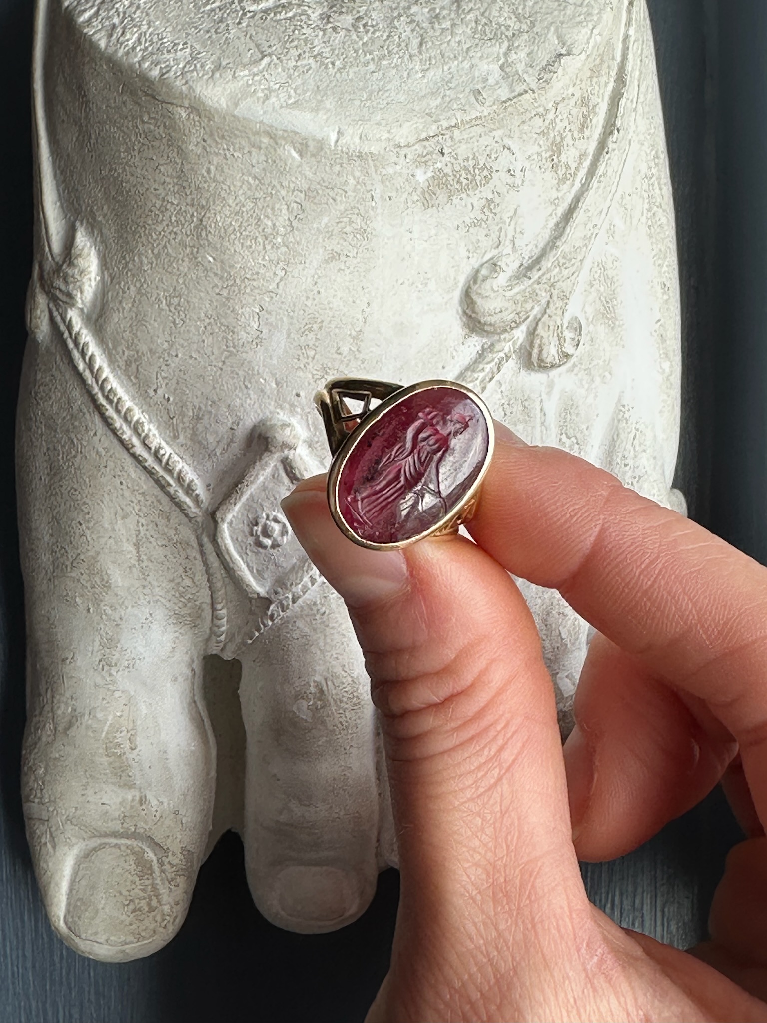 A Greek Late Hellenistic Garnet Intaglio set in a 19th century gold ring. Tyche. 