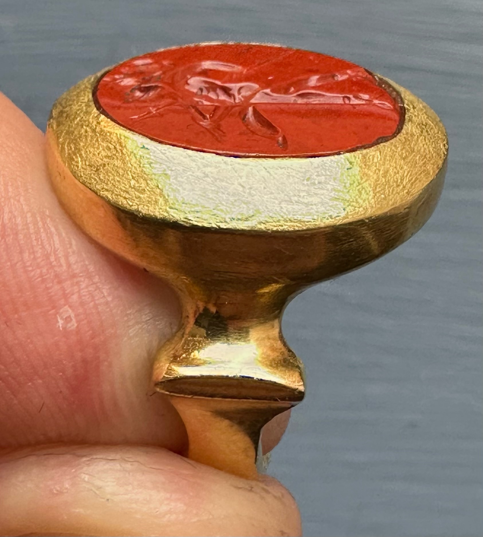 A high carat gold ring set with a Roman red jasper intaglio. Mars Gradivus